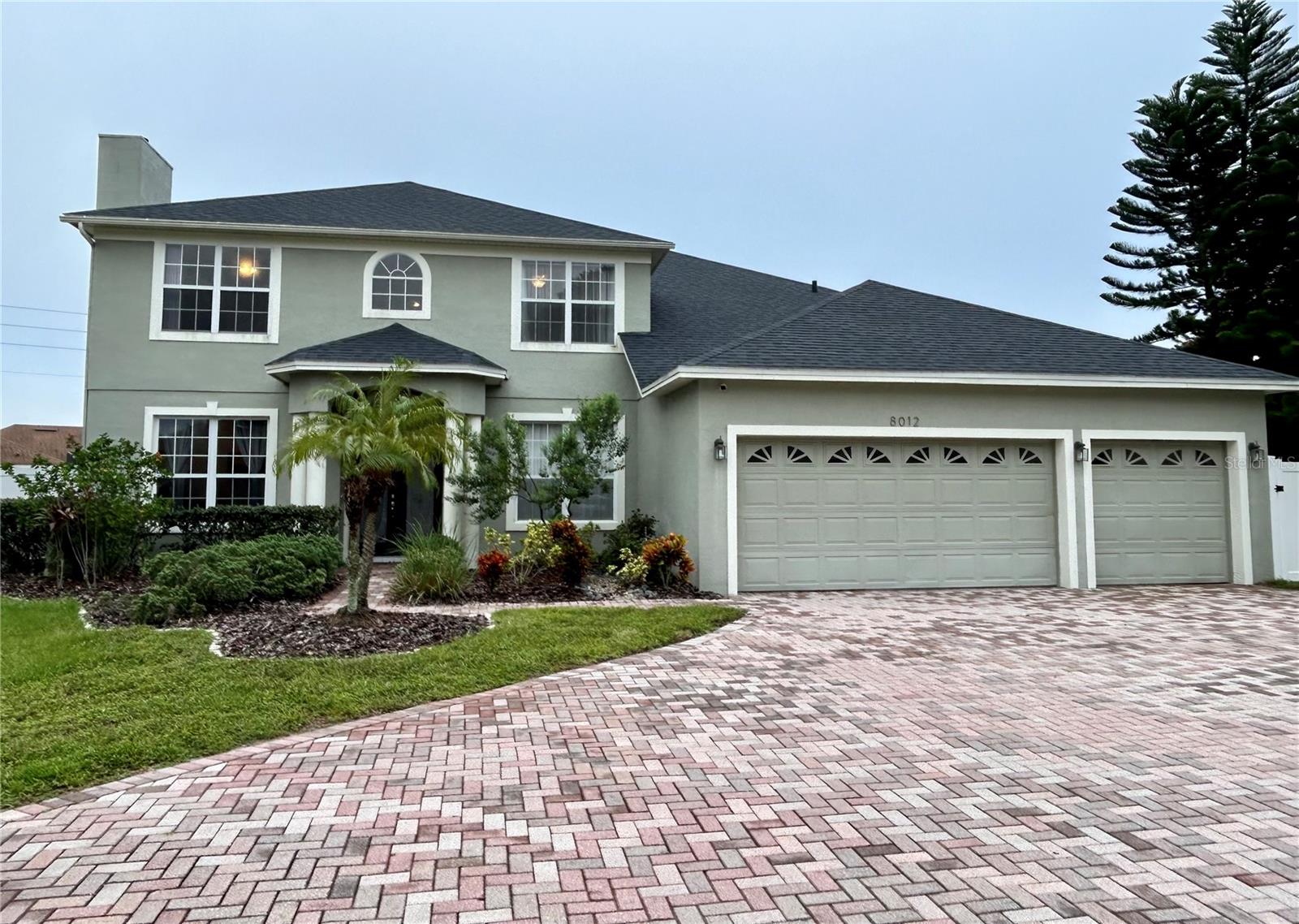 Great opportunity to own this large 5 bedroom and 3 full bathroom home in the heart of Dr Phillips. This updated home sits at the end of a cul-de-sac to provide maximum amount of privacy and no drive-by traffic or rear neighbors. The long paver driveway leads to an oversized 3 car garage. Double doors lead you into a grand foyer area with a formal living room to your left and dining room to your right. Open kitchen features beautiful granite countertops, stainless steel appliances and is ideal for entertaining with a large dinette and sit up bar area. This home is unique as it features a full bedroom and bathroom on the main floor, ideal as a guest or in-law suite. Upstairs there are 4 additional bedrooms, including a 17X19 primary suite. Primary bathroom was recently completely renovated and features a spa tub for soaking and separate glass enclosed shower stall. Three other bedrooms offer ample closet space and share a remodeled bathroom. Diamond cove is ideally situated between the famous Restaurant Row with ample dining and entertainment options and O-Town West that is being developed. Home is walking distance to elementary and high school and a middle school is being built. The area's tourist attractions are all within a 15 minute drive. Diamond cove has a community pool, tennis courts and minutes from the Dr. P Phillips Community Park. Call today for a private showing and make this your next dream home.