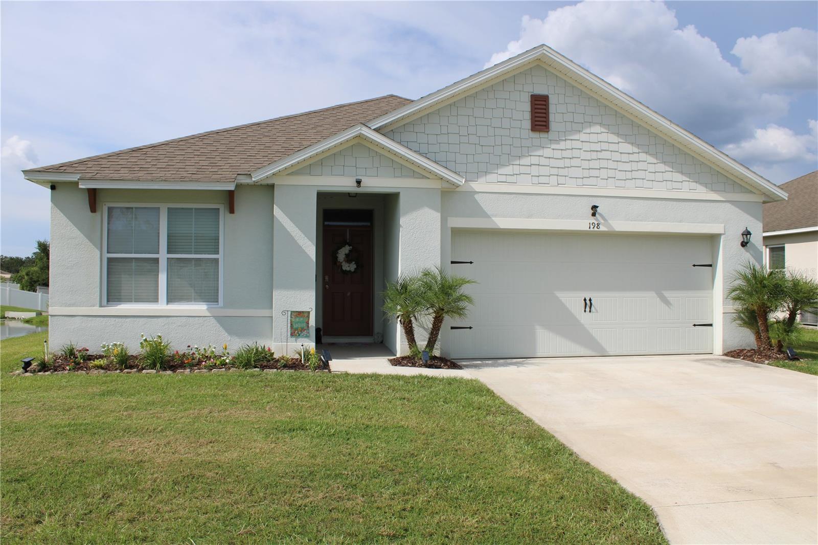 Welcome to this beautifully well maintained D.R. Horton built home. When you walk in you'll feel the love and positive energy here. Tile and Laminate flooring mostly throughout the home, stainless appliances in the kitchen. Alarm system with door and window sensors. Owners installed vinyl and aluminum fencing, screened in the patio, replaced front bedroom flooring with LVP and the Master suite with Laminate. All bedrooms have been repainted. Wooded area behind the property and a small pond to the left, so no neighbors behind or to the West of you. Don't miss out on this one, schedule your showing appointment quickly.