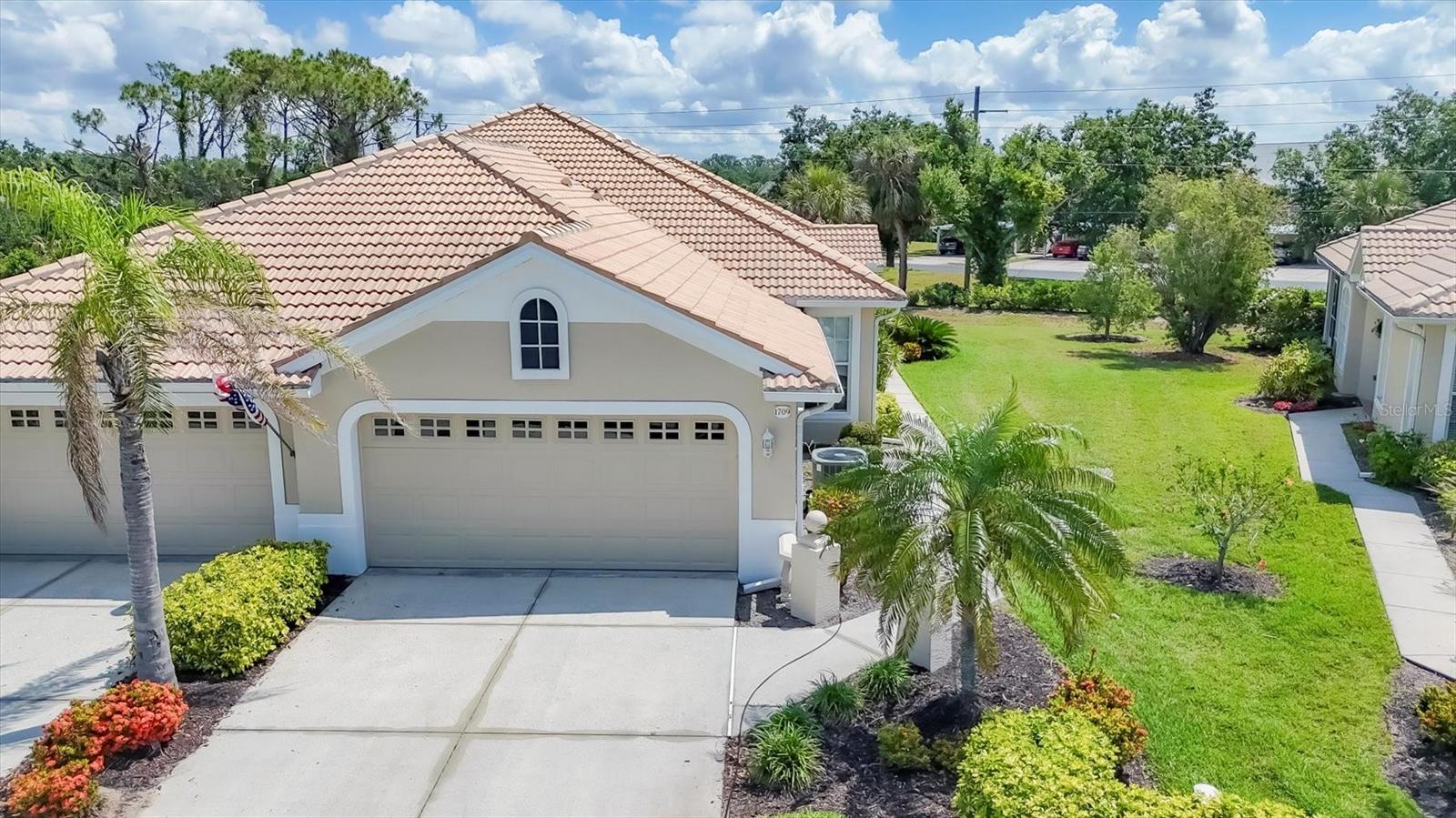 COME FIND YOUR DREAM LIFESTYLE IN PELICAN POINTE! MOST POPULAR GOLF COURSE COMMUNITY IN VENICE! No Membership required. Pay to Play. Popular 3BD/2BA/2CG. Open style floor plan with tile flooring throughout the villa. Windows on the South side of the villa create tons of natural light, covered with plantation shutters for you to decide how much comes in. Extended lanai overlooks grassy greenbelt and tropical landscaping. Located on a curve in the road provides lots of extra space from any neighbors so you can relax on your private lanai. The view from the front of the villa is nice too!! No villas across the street, just green space open views. Spacious kitchen with lots of cabinets and counter space. Stone tile backsplash Large dining area for casual or formal seating. Split floor plan. Master bedroom with en suite bath and walk in closet. Bathroom offers dual sinks, walk in shower, and garden tub. Tray ceiling with Crown Molding. Sliders out to the lanai let in light and provide access to out door space. Silhouette blinds cover sliders. Guest bedrooms at other end of villa for privacy. Guest bath in between. HURRICANE SHUTTERS. HOT WATER HEATER 2025. Not in Florida to view this property? Check out the 3D Walk through at https://my.matterport.com/show/?m=nfygLuWD5EC Pelican Pointe is Venice's premier community with resort style amenities- Clubhouse with restaurant/bar/grill, heated pool, fitness center, tennis courts, pickle ball, tons of social activities, social room/library, 27 holes of golf and pro shop. Huge and very active Women’s Association with tons of activities to choose from. Golf membership is NOT mandatory. LOW HOA fees include cable/internet, landscaping, and all amenities except golf. All centrally located minutes to Venice Beach, Venice Downtown, shopping, theatres, restaurants, highways, airports, and so much more. Come find your Florida Lifestyle today!