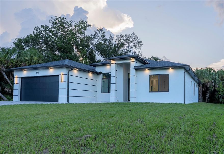 NEW CONSTRUCTION!!! WELCOME TO THIS STUNNING LUXURIOUS CUSTOM-BUILT HOME, featuring 3 bedrooms, 2 bathrooms, an office, a 2-car garage and 1,937 square feet of living space. From the moment you enter this dazzling property, you'll be captivated by the open floor plan that features 10-foot ceilings throughout the home, high-end finishes, large custom windows, fantastic design and contemporary lighting package. PREMIUM UPGRADES THROUGHOUT!  The living space feature wall offers a wired space for a TV and fireplace. A true chef's kitchen with Quartz countertops and backsplash, stainless steel appliances, built-in double oven, walk-in pantry, upgraded 42" and 18" double-stacked cabinets that include pullouts to maximize storage, LED lights under cabinets, quartz back splash and large center island for entertaining! The kitchen is open to the dinette area and great room with sliding doors leading to the large lanai. You will love the owner's suite, which features a walk-in closet, dual-sinks, private water closet, and glass-enclosed walk-in luxury tile shower. Your new home has been upgraded with beautiful fixtures and finishes, including Luxury Vinyl Floors, Hurricane Impact Glass throughout, 8' doors, outdoor kitchen, outdoor shower, all the wiring ready for the pool, oversized driveway with flat and leveled frontage, sidewalk around the house and so much more! Also, the house is wired for security cameras outside. This home is NOT in a flood zone and has been constructed to the most current building codes and standards, resulting in homeowners’ insurance premiums that are surprisingly affordable. There are NO mandatory HOA or CDD fees. Outside the home, gorgeous natural landscaping offers plenty of privacy and the opportunity to enjoy the Florida sunshine. This house is located just a short distance from stunning gulf beaches, fishing, boating, golfing, and the brand-new Downtown Wellen Park, which features shops, restaurants, groceries, Atlanta Braves Spring Training Facility and more! Easy access to I-75 and US 41. Relax and enjoy the peace & tranquility while enjoying the Florida sunshine! OWN A PIECE OF PARADISE!