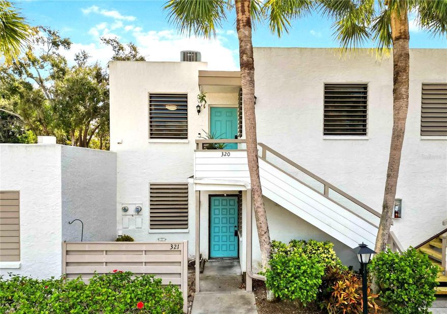 Beautifully remodeled modern condo flooded with natural light and overlooking serene, private views of lush tropical landscaping—perfect for inspiring your green thumb. The 2022 remodeled kitchen features sleek white modern cabinetry, a coffee bar, owner also added additional cabinetry for storage, and then selected top-of-the-line Samsung smart appliances. A new water heater was installed in 2022. Luxury vinyl wide-plank flooring flows through the bedroom spaces along with a neutral tile in the main living, kitchen and baths. Don't miss the full size (2022) LG washer and dryer conveniently built into the kitchen. The entire unit was also repainted in 2022 in serene colors. 

Both bathrooms offer tile flooring, with a new vanity and tub/shower combination in the primary and a walk-in shower in the private guest en-suite. The primary suite is enhanced by a custom walk-in closet in addition to the standard closet. 
Owner recently added cellular shades to the rear sun porch for additional privacy and they also help with insulation.
Peaceful green views, modern upgrades, and refined finishes create an effortless, upscale Florida lifestyle.
 
Included in the HOA fee's are trash, water, cable, internet, exterior maintenance and grounds, pool, pickle ball and tennis courts. 
The Wildewood Springs Condominiums, modernist in design, are arranged in an 88-acre Audubon bird and wildlife sanctuary, an old Florida oasis of palm trees, live oaks, flowering trees, and lakes. Residents enjoy biking and walking through the lush, tropical grounds.
Some furnishings available for sale.