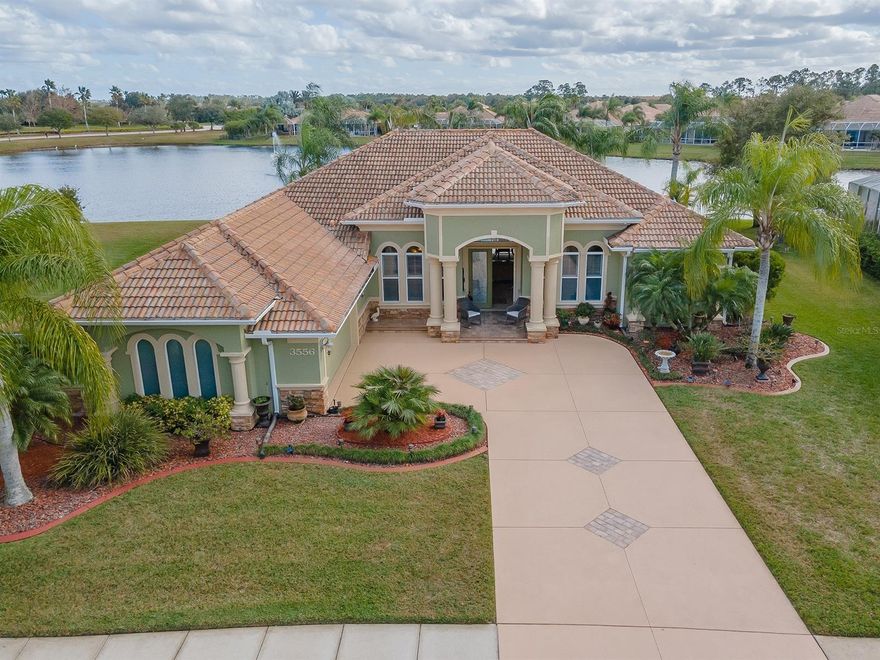 Luxurious lakefront living in this immaculate move-in ready 3 bedroom 2 bath pool home with office/bonus room. Walk through the double entry doors and be greeted by the oversized living room with double tray ceiling and sliders that lead to the covered lanai, with screened, solar heated salt water pool/spa overlooking the lake. You will love entertaining in the large, eat-in kitchen with wood cabinets, granite countertops, breakfast bar and new stainless appliances. Oversized primary bedroom with tray ceiling has private door to pool deck and includes walk-in closet and en-suite bath with garden tub, separate shower and dual sink vanity. Spacious guest rooms with ample closet space and beautiful guest bathroom. Recent upgrades includes new pool screens, new pool equipment, new water heater with recirculation pump, newer garage door and freshly painted driveway. Plantation shutters, tile and wood flooring throughout, formal dining room and indoor laundry room. Venetian Bay community features include golf course, club house, town center, walking/bike trails, shopping, restaurants and 15 minute drive to our beautiful beaches. ;Water: City