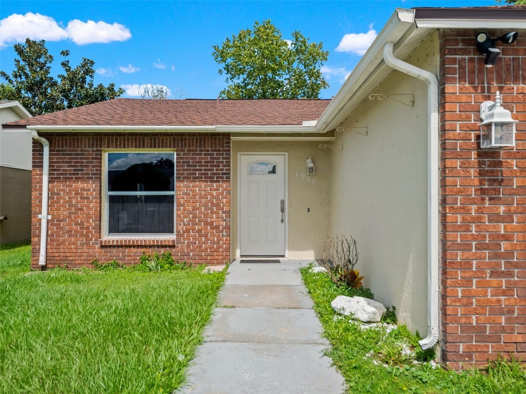 Photo of 8937 Valencia Gardens Drive, Orlando, FL 32825 (MLS # W7889493)