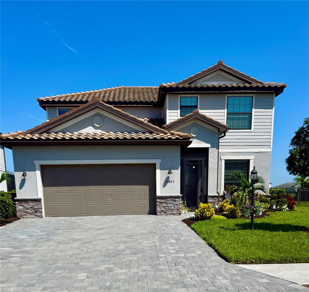Welcome to your Florida dream home, in Lorraine Lakes at Lakewood Ranch, the #1 master planned community in the country! From the moment you walk through the screened front porch, this beautiful lakefront pool home has 4 bedrooms, 3 baths, a bonus room, as well as 2,546 square feet of gracious living space. This home is also in walking distance to the Amenity center. Once inside, you’ll love the open floor plan with the spacious kitchen with natural gas, and a huge dolomite island with seating for all your guests. Stainless steel appliances, including a gas range, soft-close cabinetry, large farm sink, and crown molding on the cabinets, a Custom backsplash of “Fantasy Brown” dolomite up to the cabinets with a Large custom wall pantry. In the gathering room, the large sliding glass doors allow easy access to your covered “No See-Um” screened in lanai with your heated pool and spa, ideal for relaxing and entertaining while sitting under the Sunbrella retractable awning looking at peaceful views of the lake for that easy indoor/outdoor lifestyle we love here in Florida. Living in Lorraine Lakes means enjoying a vibrant, active lifestyle with 24/7 guard-gated security, internet and cable are included with your HOA fees and it is a maintenance-free community, so get rid of that lawn mower! You will enjoy some of the most extensive amenities in the surrounding area, like a clubhouse with 2 bars and indoor and outdoor dining, fitness center, indoor sports courts, resort pool, lap pool, splash pad, Bocce ball court, plus pickleball, tennis, basketball, sauna, a playground and trails surrounded by stunning lakes. Don’t forget about the dock overlooking the lake to throw your pole in but don’t forget its catch and release! When you want to venture out on the town, a short drive away are options. Lakewood Ranch downtown and Waterside are minutes away for shops and dining, live music, polo and international events then Tampa, Sarasota and St. Armands Circle for finest dining and shopping. SELLER is contributing $10,000 towards closing costs with a signed contract by August 29th! Schedule your appointment today!