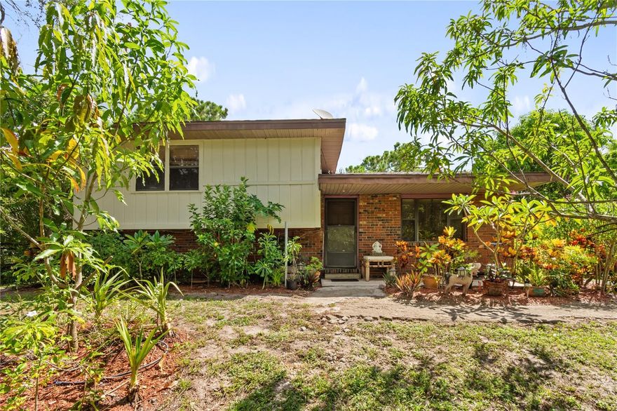 Welcome to 1360 Collany Lane, a rare opportunity in Frostproof offering 9.5 acres of land with direct Highway 27 frontage. This versatile property combines convenience with privacy and features a unique 3-story split-level bungalow with a new roof (2018). The grounds include multiple large detached sheds, perfect for storage, workshops, or equipment, along with several exotic fruit trees. With ample room to expand, this property is ideal for multigenerational living, offering plenty of space to build an additional home. Its prime location and expansive acreage provide endless possibilities for residential, agricultural, or hobby use.