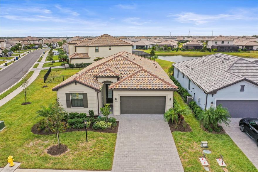 Want to feel like you are on vacation all year long? This home has everything you need to live the lap of luxury without compromise in the prestigious Lorraine Lakes community, perfectly blending resort style amenities, convenience and value — now offered at an exceptional price!!! This nearly new (2022) home features 4 bedrooms, 3 full baths, 2016 sf! This is one of the most popular floor plans boasting open-concept living with stylish finishes and upgraded fixtures throughout, light and bright interiors designed for comfortable, move right in and start unpacking! Take advantage of this awesome oversized corner lot with ample room for the kiddos or 4 legged friends! Located in one of the nation’s top-selling master-planned communities, you’ll enjoy resort-style amenities with an expansive clubhouse with social room and catering kitchen, Lifestyle director that curates resident events, holiday parties, fitness classes, book clubs, and more. Resort-style pool with spa, cabanas, Poolside Bar and Restaurant, Splash park and kids’ splash zone for family fun, State-of-the-art fitness center and aerobics studio, complete with sauna, Indoor and outdoor basketball courts for pickup games or organized events, Outdoor tennis and pickleball courts, putting green, plus a sand volleyball court and bocce ball court. Enjoy everything that Lakewood Ranch has to offer with top-rated schools, premiere dining, shopping and nature trails!  Just minutes from Main St, Waterside, UTC Mall and some of the most stunning beaches you can imagine! Built to the most updated hurricane standards and includes shutters for peace of mind! Whether you're seeking a primary residence, second home, or investment property, this home delivers unbeatable value in a sought-after neighborhood. Don’t miss this rare opportunity — contact us today for your private tour and experience the best of Lorraine Lakes living!