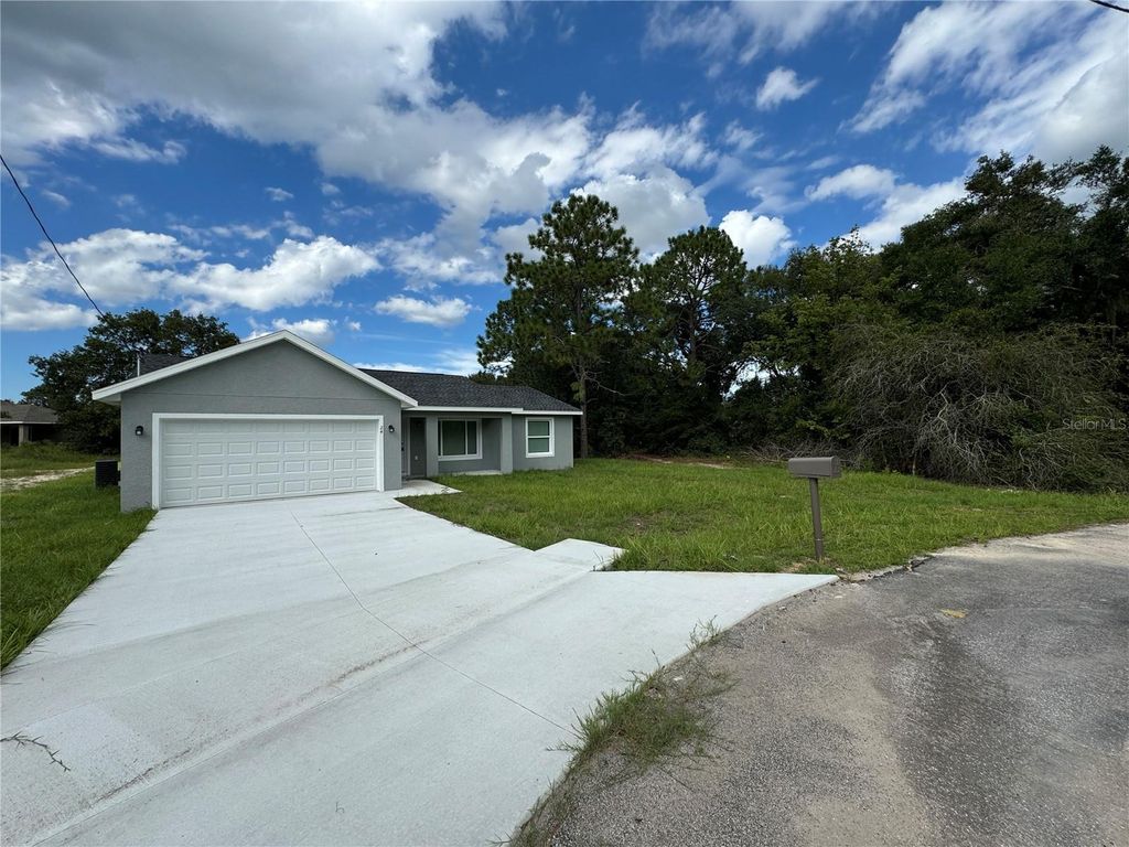 Photo of 24 Malauka Loop Place, Ocklawaha, FL 32179 (MLS # O6379628)