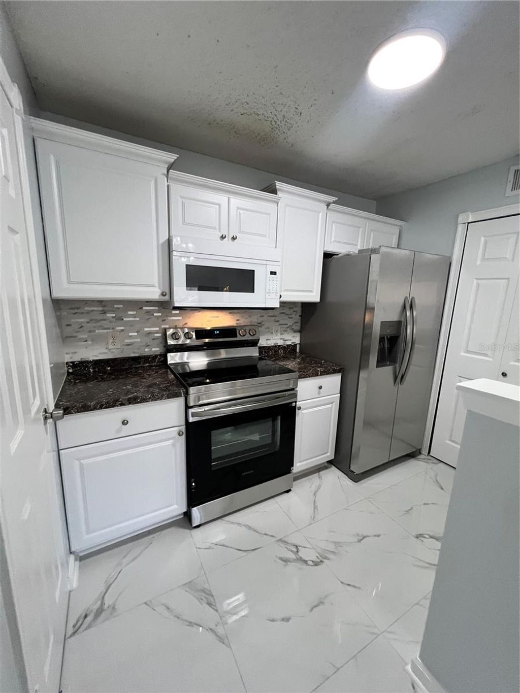 Photo of 3550 Tobago Lane #304, Tampa, FL 33614 (MLS # TB8475051)