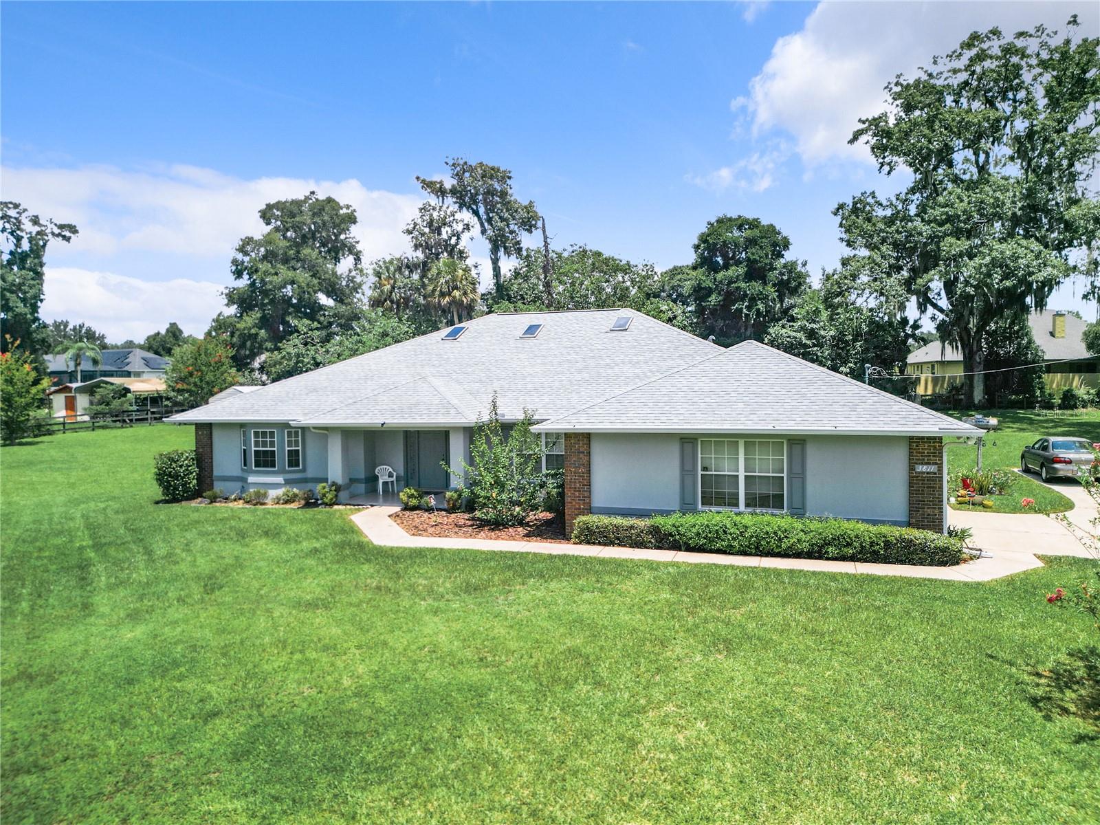 Nestled on 1.39+/- acres this property offers a wonderfully peaceful escape beautiful landscaping surround this charming home, features a 3
bedroom, 2-bathroom split bedroom plan with a large living area, rock fireplace , big library for cozy reading. The spacious backyard has a
screened in porch , the perfect area to relax with a cup of coffee or glass of wine