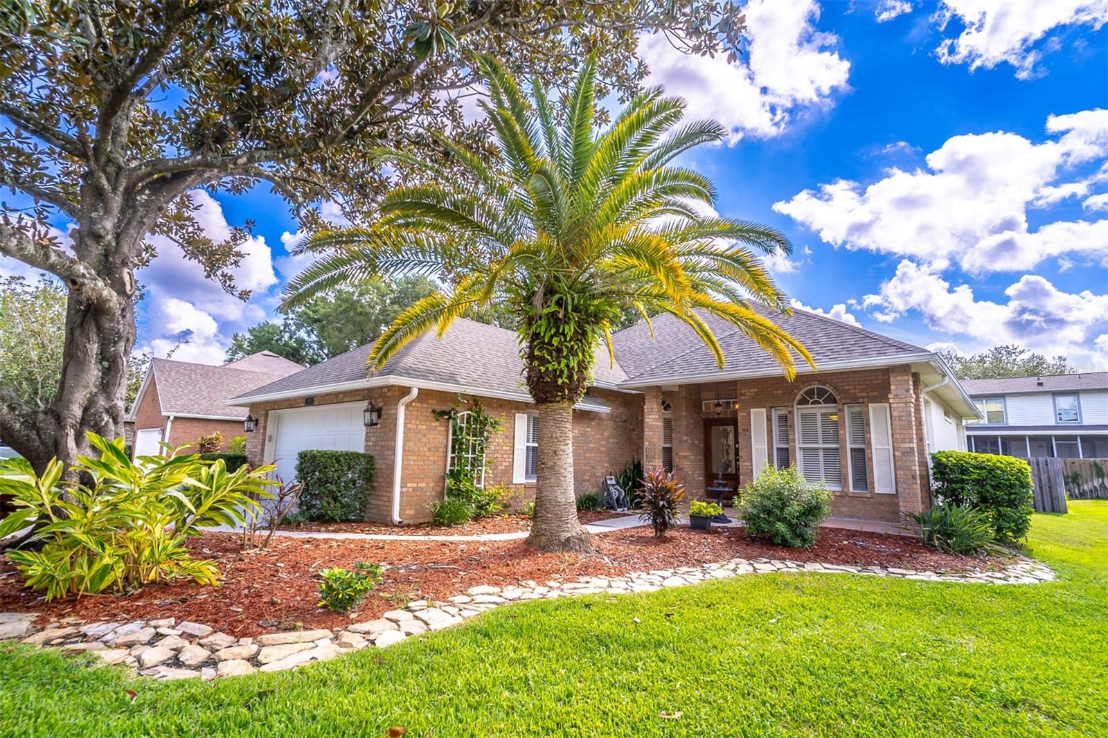 One or more photo(s) has been virtually staged. Charming three bedroom, two bathroom home with a den/office in one of Oviedo‘s, most coveted neighborhoods, Lakes of Aloma. This unique neighborhood features beautiful brick architecture, mature tree-lined streets, and a desirable location. Enter through the beautiful cut glass front door to a fantastic open floor plan featuring wood floors and plantation shutters. This home showcases a renovated kitchen with quartz countertops, stainless steel appliances and travertine flooring. Bright natural lighting highlights the breakfast nook. The primary bedroom and en suite bathroom offer a spacious walk-in closet and beautiful vanity, garden tub and separate shower. Just off the living room you will find the office/den/flex room ideally suited for whatever you like: office, fitness, playroom and more. Washer and dryer are currently located inside, but can easily be moved to garage to create more inside space. Access the backyard via the door from the kitchen or the primary bedroom. There, you’ll find a covered patio and a paver deck. Roof replaced in 2018 and HVAC system is 2023. Schedule your showing today!