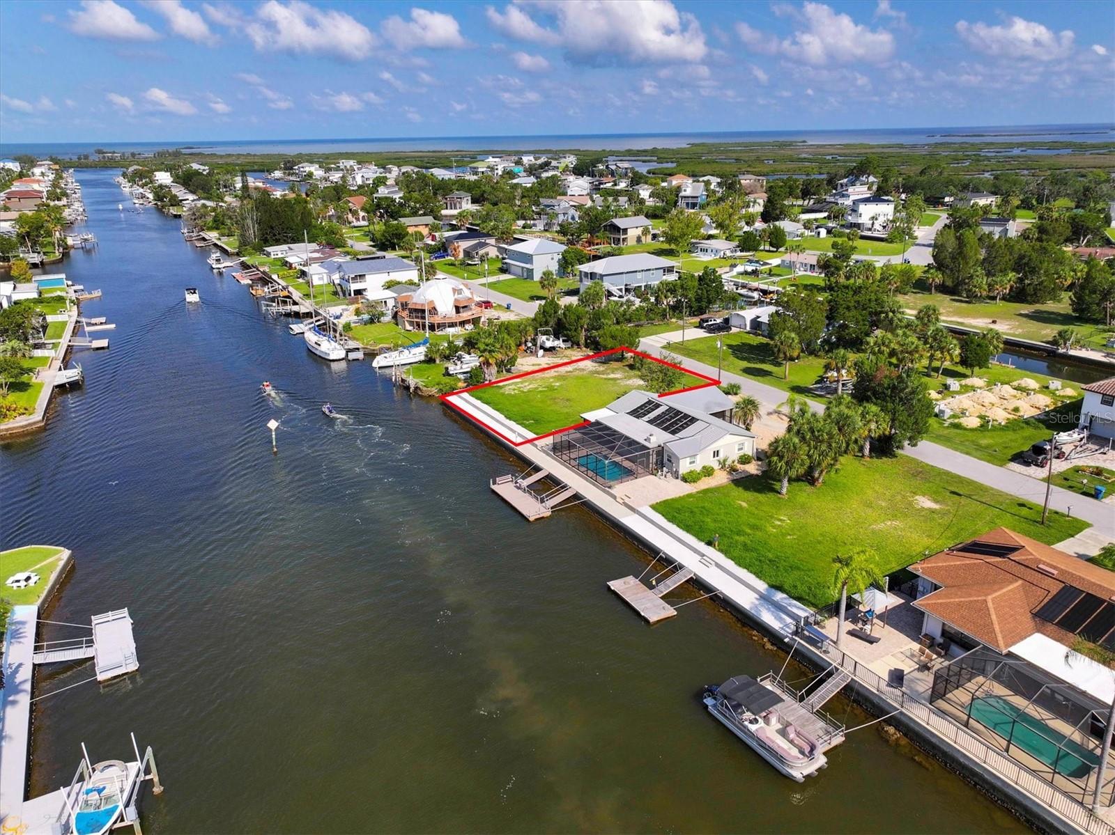 Build Your Gulf Coast Fishing Retreat – 70 Ft of Direct Gulf Access on Hernando Beach Main Canal!
Welcome to Hernando Beach, where your dream of coastal living meets the ultimate boater’s paradise. This exceptional direct Gulf access building lot offers 70 feet of brand new concrete seawall on a Hernando Beach’s main saltwater canal with no fixed bridges standing between you and open water—ideal for serious anglers and boating enthusiasts alike. Imagine catching redfish, snook, and snapper right from your backyard while dolphins and manatees cruise by in the tide.
Located in the most desirable section of Hernando Beach, this rare property offers unrestricted boating access, gorgeous unobstructed marsh views, and no HOA or deed restrictions. That means short-term rentals are allowed, trailers and commercial vehicles are permitted, and privacy fencing up to 8 feet high is welcome.
This is the section of Hernando Beach that boaters covet most—where the saltwater canals rise and fall with the tides and lead straight to the Gulf of Mexico. Hernando Beach is a secluded coastal hamlet tucked away along Florida’s Nature Coast—quiet and private, yet only minutes to US-19 for shopping, dining, hospitals, and big-box conveniences. Tampa International Airport is just an hour away, and the magic of Orlando is only a 90-minute drive.
Explore world-class inshore and offshore fishing, indulge in fresh seafood from local markets, or enjoy a laid-back waterfront vibe with tiki bars and marinas just around the corner. Plus, you're only 5 minutes from the crystal-clear waters of Weeki Wachee Springs, perfect for kayaking, paddleboarding, and swimming year-round.
Whether you're looking to build your forever home, a weekend getaway, or a lucrative short-term rental, this lot offers endless possibilities. Come live the Gulf Coast fishing lifestyle where every tide brings new adventure.