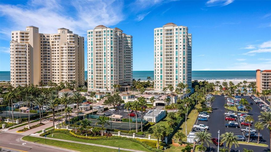 Offering the pinnacle of beach and water views and the grandest of settings, 3,904 square feet of 21st floor penthouse spaciousness at The Grande on Sand Key awaits your consideration. The soaring views of the Gulf of Mexico, Clearwater Beach and the Intracoastal Waterway are  breathtaking. Emotional even. To add scale to the vastness of your view, the skylines of St. Petersburg and Tampa are also visible from this spectacular home. We welcome your discovery of an impressive list of resort style amenities and soothing livability found at this picturesque coastal gem. We think your expectations will be delighted with all you find here. In the category of unexpected, how often have you found a beach penthouse with its own *** private two car garage *** right next to the elevator lobby? A note regarding bedrooms: Three en-suite bedrooms and a further two flex rooms allow for the potential of five bedrooms. Those two extra rooms each feature balcony access. One is currently being used as an office and the second is being used as a media room. Furnishings are included in the list price. Please experience this rare offering for yourself and schedule a showing today.