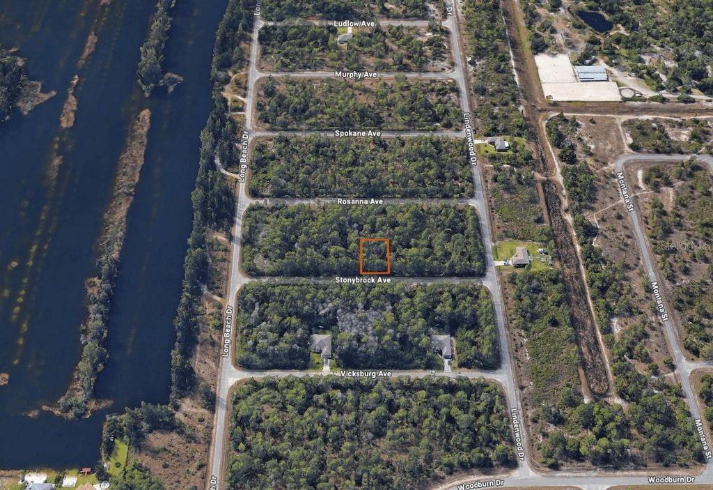 Photo of 309 Stonybrook Avenue, Lehigh Acres, FL 33972 (MLS # C7514341)