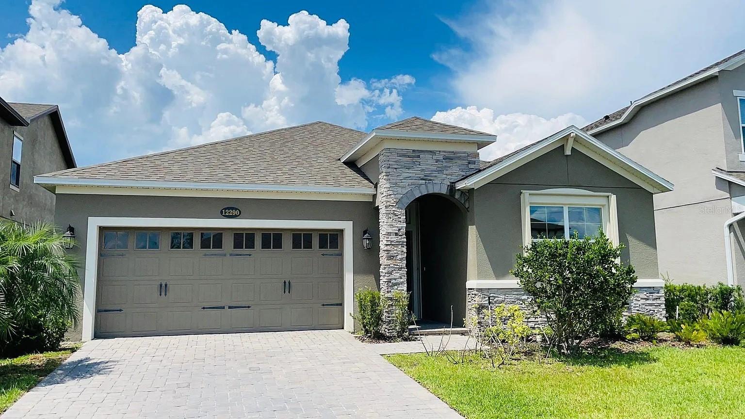 Look no further! This sweet, cozy 3 Bedroom 2 Bath home would end your house hunt! It is located in a well-maintained, gated community called Somerset Park, near the booming Lake Nona Town Center, and the new Lake Nona West shopping center, with easy access to Publix, restaurants, fitness & wellness center and more. This house features the very efficient open floor plan with a dedicated breakfast area, an angle designed large kitchen island and vaulted ceiling in the living/dining area. Outside of the 3-panel sliding door in rear is a large paved extended patio with screened lanai and an outdoor kitchen in it. The primary bedroom has a spacious luxury ensuite bath with a separate linen closet, and a large walk-in closet. This house is also equipped with hurricane shutters providing added protection during storm weather. With great location, convenience of quick access to groceries, shopping centers, wellness centers and high way systems, and with very reasonable, competitive pricing, you will definitely love this house!
