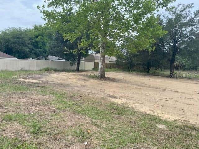Prime opportunity to own a level half-acre lot on a quiet private road ideally located between Eustis and Mount Dora. Just minutes from shopping, dining, and everyday conveniences, this property offers both accessibility and privacy. As the last parcel on the street, it enjoys a peaceful setting with attractive views of a nearby orange grove. No HOA restrictions, making it ideal for investors, builders, or families looking to create a custom home or place a manufactured home. A rare chance to secure a flexible homesite in a desirable and growing area.”