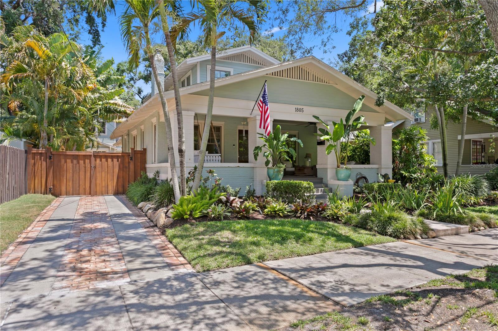Welcome home to this beautifully updated and impeccably maintained historic
bungalow, nestled in the heart of the highly sought-after Hyde Park neighborhood. Just
steps away from the charming shops and vibrant dining of Hyde Park Village—and a
short stroll to Tampa’s iconic Bayshore Boulevard—this home offers the perfect blend of
timeless character and modern convenience. Start your mornings on the inviting front
porch or unwind in your private tropical backyard oasis with pool, outdoor kitchen, and
additional covered porch—ideal for seamless indoor-outdoor living and entertaining. As
you step inside, you're greeted by rich hardwood floors, a cozy gas fireplace, beams,
and timeless historic details that elevate the charm of the front living and dining room.
Flooded with natural light, the open concept kitchen features a spacious center island
with prep space and a secondary sink, along with top-of-the-line appliances including a
Wolf gas range, Sub-Zero refrigerator, and a wine fridge and flows into the family room.
The second and third bedrooms showcase charming board and batten detailing and
share a beautifully updated bathroom. Upstairs, the private primary retreat features a
spa-like bathroom with a luxurious soaking tub and elegant marble finishes. Just off the
family room, escape to a backyard oasis perfect for unforgettable summer
evenings—complete with an outdoor shower. The outdoor space is enhanced by lush,
mature landscaping, newer privacy fencing, and the peace of mind that comes with a
whole-house generator. Above the one-car garage—complete with sleek epoxy flooring
and an additional room perfect for storage—is a private detached guest suite or ideal
home office, featuring its own en suite bathroom and generous closet space. This home
is in the gorgeous area of Hyde Park with convenient access to Tampa General
Hospital; Memorial Hospital, MacDill AFB, Kate Jackson Park, and Davis Islands, 15
min. to Tampa International Airport and in top rated Mitchell Elementary, Wilson Middle,
and Plant High School. What are you waiting for; call today for your private tour of this
beautiful offering.