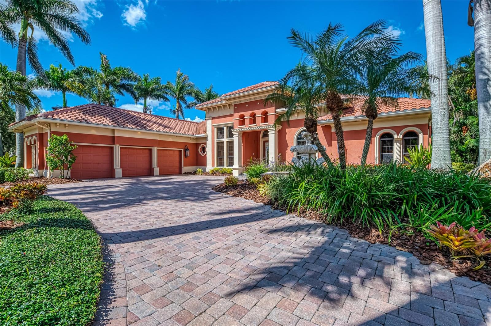 One or more photo(s) has been virtually staged. Located in the exclusive, gated community of Silver Oak, this Mediterranean-inspired estate reflects the quality craftsmanship of John Cannon Homes. The stately exterior—graced with a flowing front fountain, lush landscaping, and a circular drive leading to a side-load 3-car garage—offers a warm, inviting welcome. A brand-new tile roof (2024) adds peace of mind. The home shows exceptional care and is truly worth seeing in person to appreciate its quality and charm. Inside, soaring ceilings, extensive wood moldings, and fine architectural details create a timeless ambiance that could easily be refreshed with simple updates such as new lighting and paint for a more modern aesthetic. The split-bedroom floor plan includes a spacious family room, a formal dining area with tall windows, a wood-floored office, and a gracious living room anchored by a gas fireplace with a custom mantel. Two guest bedrooms are privately situated behind a pocket door, one featuring a built-in settee. The primary bedroom is a serene retreat with its own built-in settee, a tray ceiling with mood lighting, and a luxurious bath with dual vanities, a private water closet, a walk-in shower, and a deep soaking tub. The chef’s kitchen blends beauty and performance, offering a 6-burner Dacor gas cooktop, full-sized Sub-Zero refrigerator and freezer, Bosch oven, microwave, warming drawer, a center island with prep sink, and abundant counter space for culinary creations. A full-sized Sub-Zero wine cooler is paired with a dry bar and glass-faced cabinets, perfect for effortless entertaining. Outdoors, a tranquil water view sets the backdrop for the screened lanai, complete with pool and spa—an ideal space for relaxing or hosting gatherings. Silver Oak, part of the master-planned community of Palmer Ranch, offers two gated entrances, a 24-hour manned gate, sidewalks for leisurely strolls, and mature, meticulously maintained landscaping. The neighborhood is known for its well-crafted, thoughtfully designed homes, and its natural gas infrastructure adds modern convenience. Residents enjoy close proximity to premier golf courses, upscale shopping, fine dining, and the world-famous white sands of Siesta Key Beach—combining enduring quality, timeless style, and an exceptional Sarasota address.