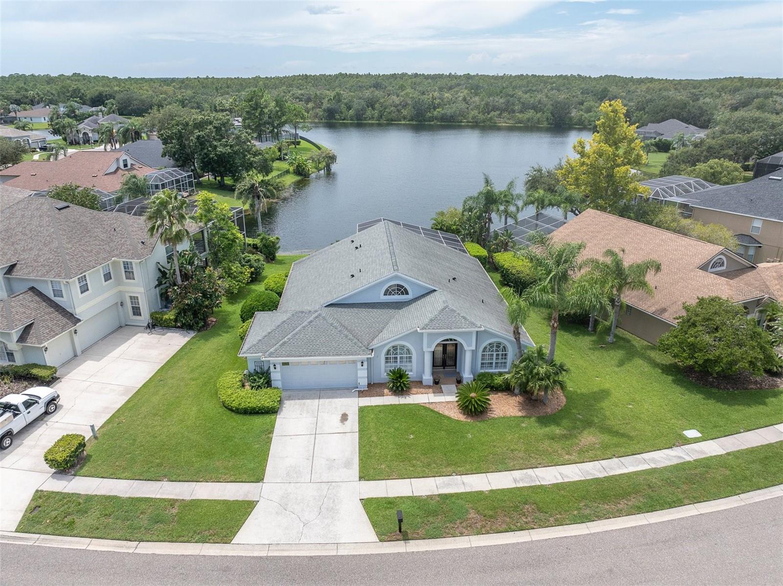 Welcome to this stunning waterfront pool home in the highly sought after gated golf community of Cheval, located in the coveted Steinbrenner High School District with access to Tampa's top-rated schools! This deed-restricted community offers three gated entrances for safety and peace of mind. Step inside this four-bedroom three-bath executive home where the vaulted ceilings and an open floorplan fill the living space with natural light. Enjoy unobstructed lake and wooded conservation views, along with breathtaking sunsets every evening.
The oversized primary suite opens directly to the pool and lanai, and features a spa-like bathroom with a jetted soaking tub, oversized walk in shower, and dual walk in closets. Additional highlights include an inside laundry room with newer washer and dryer, an oversized screened lanai, and a separate fenced area outide the lanai - perfect for children or pets.
This prime oversized lot offers serene lakefront living, while the roof (2019) and oversized two-car garage with abundance of storage, new pull down ladders, and newly tiled attic add peace of mind. Conveniently located just minutes to the Veterans Expressway and 20 minutes to Tampa International Airport!