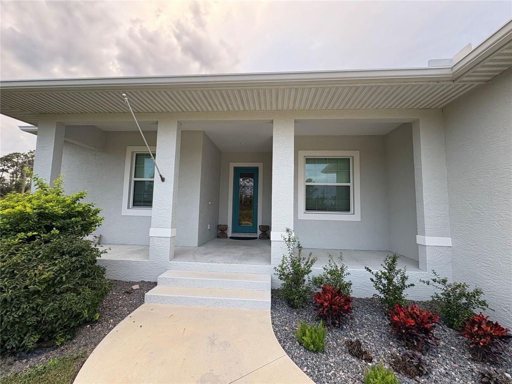 Photo of 14377 Overlook Avenue, Port Charlotte, FL 33981 (MLS # C7517802)