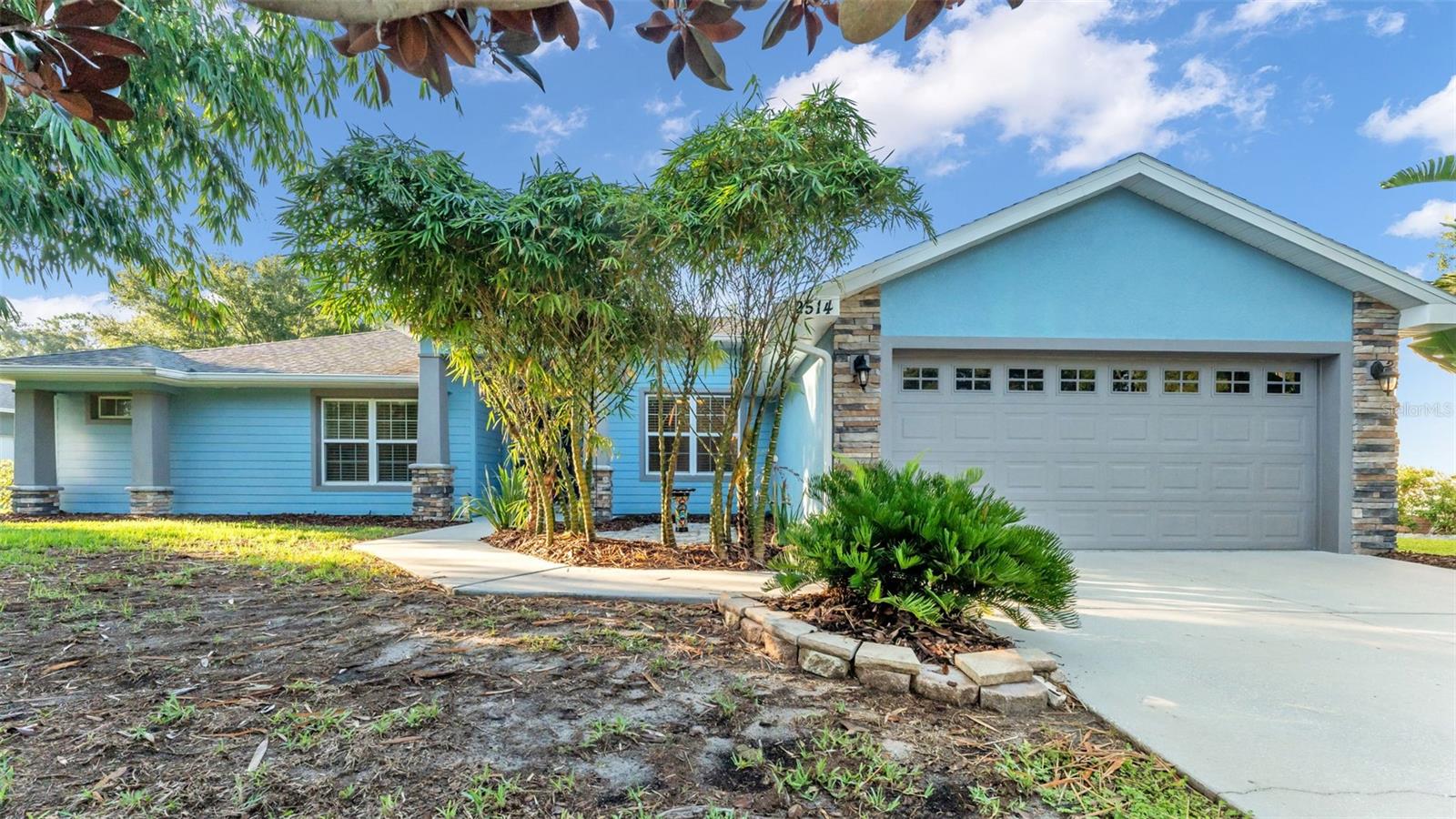Welcome to this exquisite 3-bedroom, 2-bathroom pool home with a dedicated office, set on a spacious half-acre lot in the highly desirable Deer Brooke subdivision of South Lakeland. Built in 2015 by Danny Sadler, Inc., this custom-crafted masterpiece blends modern design with timeless craftsmanship, offering the perfect combination of style, comfort, and functionality. As you step inside, soaring ceilings and elegant crown molding immediately create a sense of openness and sophistication. Beautiful wood laminate flooring runs seamlessly throughout, adding both warmth and durability. The expansive living room is designed for family gatherings and entertaining, offering effortless flow and connection between the main living spaces. At the heart of the home, the chef’s kitchen is a true showstopper, featuring gleaming granite countertops, stainless steel appliances—including a newer dishwasher and induction oven—and abundant cabinetry and counter space to inspire your culinary creativity. A formal dining room, currently styled as a cozy study, provides versatile space to suit your lifestyle. The primary suite is an elegant private retreat, highlighted by tray ceilings and French doors leading directly to the serene lanai and pool. The spa-like en-suite bathroom features dual vanities, a walk-in tiled shower, and a soaking garden tub, creating the ultimate space to relax, unwind, and recharge at the end of the day. The spacious home office offers a quiet space for work or study at the front of the home. Two additional bedrooms on the opposite wing each include walk-in closets, ensuring comfort, privacy, and ample storage for family or guests. A thoughtfully designed second bathroom opens directly to the screened-in patio and pool—perfect for outdoor living. Step outside to your poolside paradise, where you can relax and entertain under the screened-in patio while taking in the tranquility of your backyard. With no rear neighbors and a natural backdrop, the sparkling pool invites you to unwind. Open the French doors and the outdoor living area seamlessly blends with the open floor plan, creating the ideal setting for a festive celebration or a memorable family barbecue. Conveniently located near shopping, dining, and with quick access to the Polk Parkway, commuting to Tampa or Orlando is a breeze. Move-in ready and meticulously maintained, this exceptional property is awaiting new owners ready to enjoy all it has to offer. Don’t miss the opportunity to make this South Lakeland pool home your own!