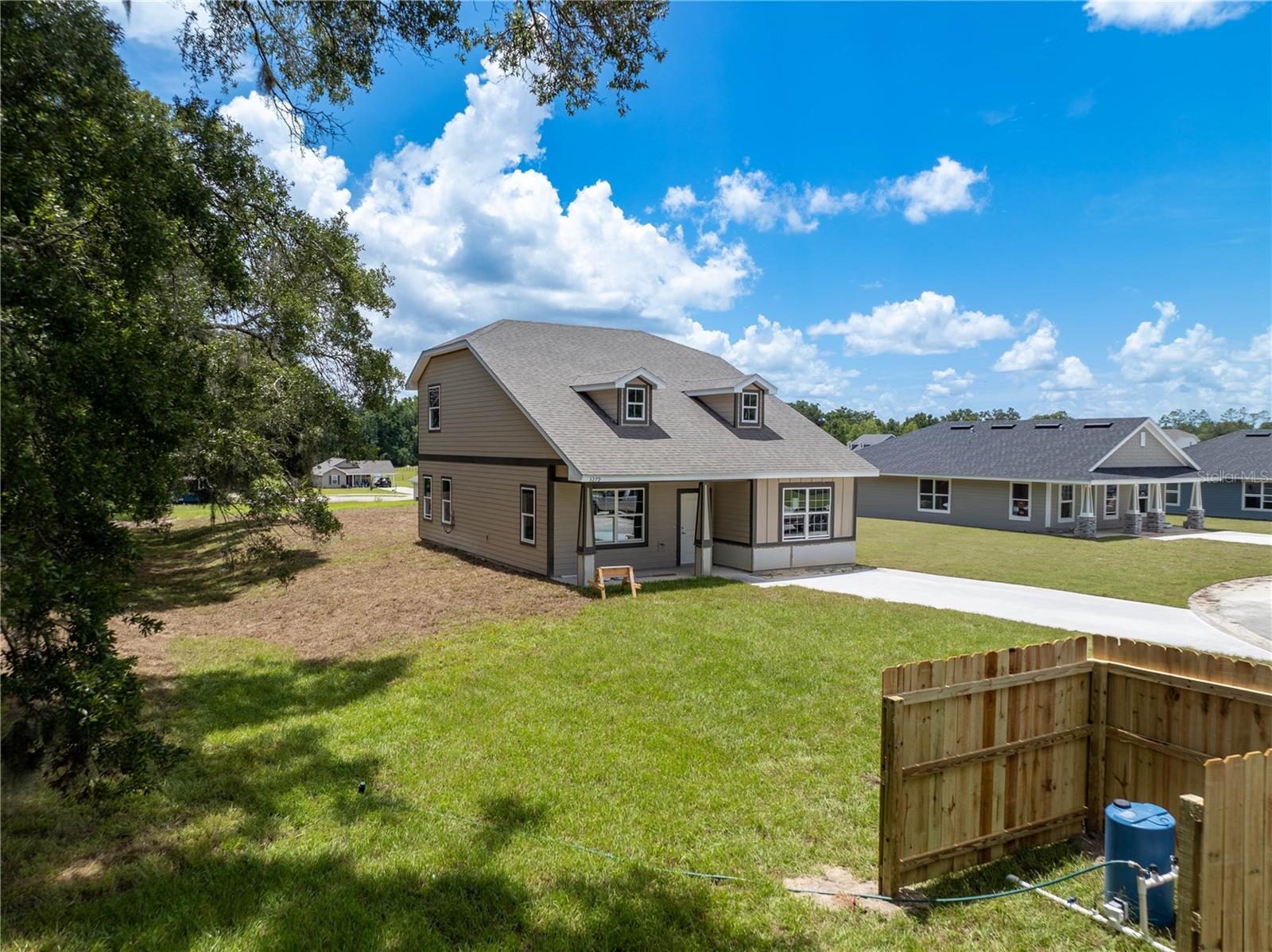 Under Construction. 15k to cover closing costs, rate buy down or upgrades using builder incentives and a preferred lender. only 1,000 deposit to secure this home. Experience peaceful country living just minutes from the Suwannee River and only 50 minutes to Gainesville in this brand-new, two-story home designed for comfort and space. Featuring 1,777 sq. ft. of well-planned living space, this home boasts a rare layout with the entire upstairs dedicated to a massive oversized primary suite—your private retreat with scenic views and a luxurious ensuite bathroom complete with a 5-foot one-piece fiberglass shower. Only 8 minutes from the Suwannee River.
The open-concept main floor is perfect for entertaining, with a spacious kitchen featuring a large pantry, and a cozy living area that flows out to a back patio ideal for BBQs or sunset watching. A convenient storage closet is tucked under the stairs for extra functionality.
Enjoy the benefits of modern systems including a Trane AC unit with dual thermostats for upstairs and downstairs comfort, a 50-gallon water heater, and a private well with chlorinator injector already installed.
Whether you’re looking for a peaceful full-time residence or a weekend getaway near the river, this thoughtfully built home offers the best of both worlds—new construction with rural charm.