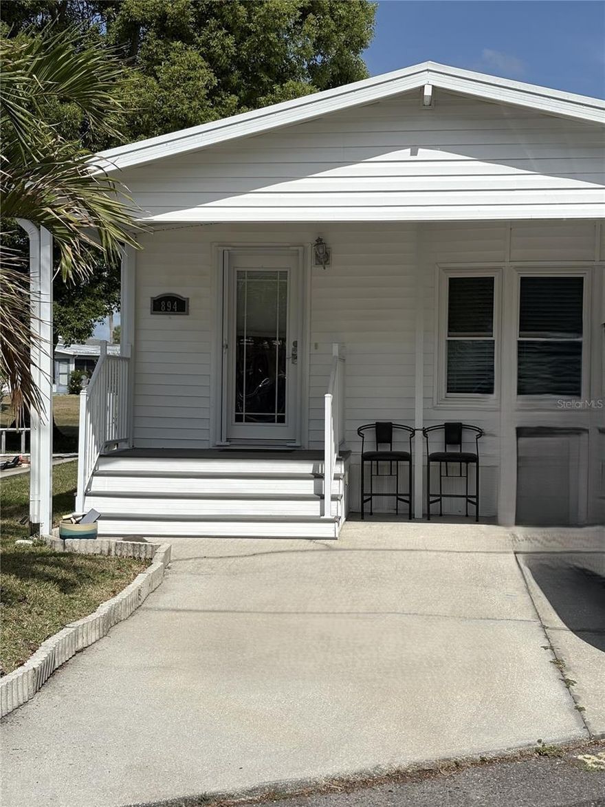 Vacation or Year-Round Living! This fully furnished 2-bed, 1.5-bath home is located in the 55+ guard-gated community of Outdoor Resorts of Orlando, right on the golf course and just 6 miles from Disney, with easy access to Universal and SeaWorld. Enjoy a new roof (2023), bright open living and dining areas, a well-layed out kitchen with plenty of storage, and a versatile second bedroom with a Murphy bed and office setup.  Community amenities include Lake Davenport access, pools, tennis/pickleball, shuffleboard, 9-hole chip & putt golf, a clubhouse with entertainment, and more. Don’t miss this charming, move-in ready home in a prime location!