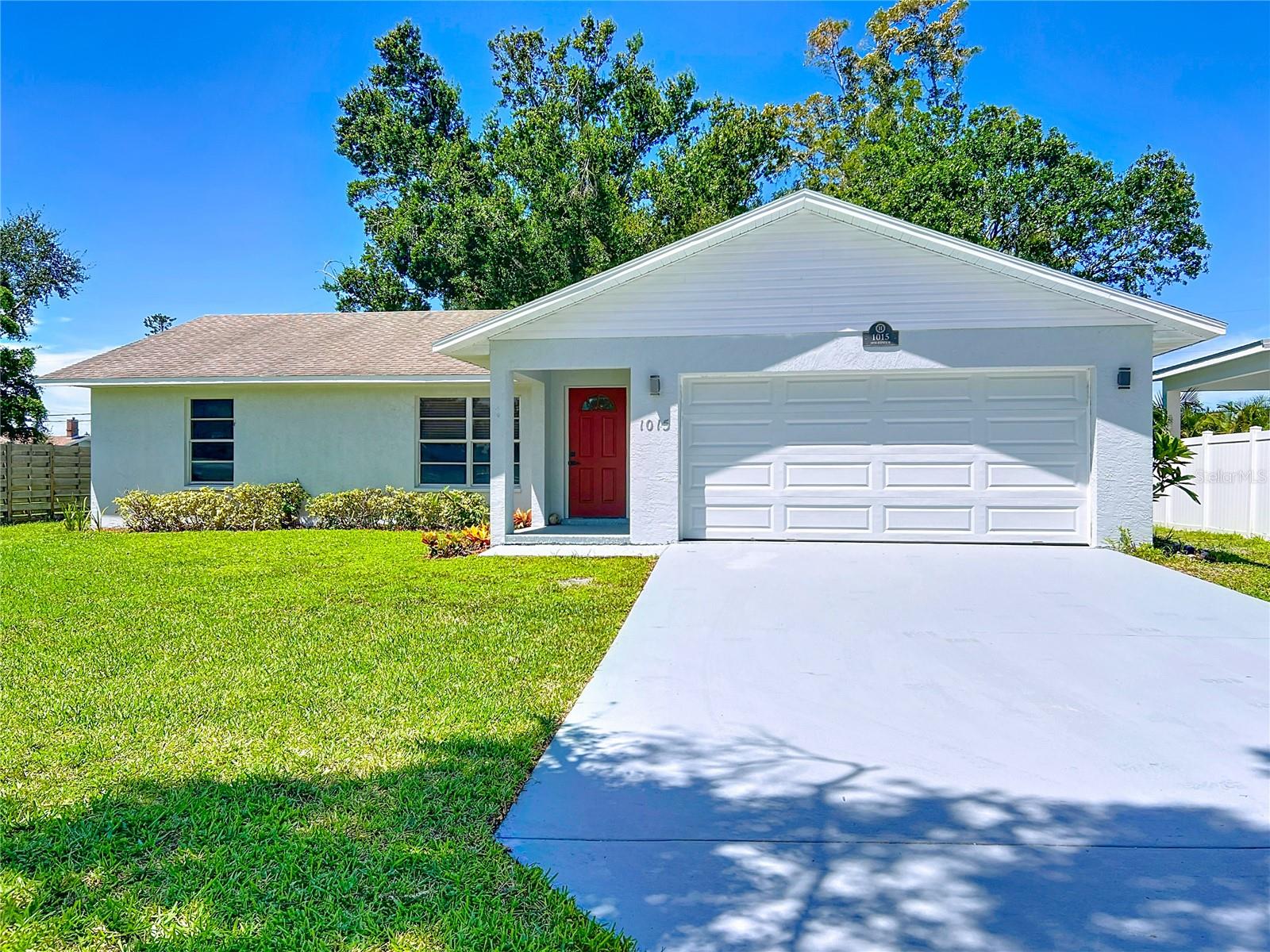 NO HOA/NO CDD- Looking for an investment property or a place to call home sweet home? Look no further! This renovated home in Bay View Park, of Palmetto features an inviting open concept floor plan with beautiful engineered wood floors throughout the main areas and new carpet in the bedrooms. The kitchen boasts brand new wood cabinets, granite countertops, and stainless steel appliances. Enjoy a spacious master bedroom complete with a walk-in closet and en-suite bathroom. The laundry room is conveniently located inside the home that includes a newer washer and dryer. Relax in the screened-in lanai or enjoy the privacy of the backyard. This property is conveniently situated near shopping, dining, banks, entertainment, parks, and the Ellenton Outlet Mall. It has easy access to downtown Palmetto and Bradenton, St. Pete, Tampa, the beautiful beaches, and I-75.