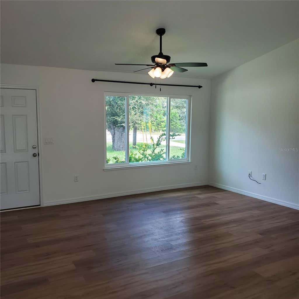 Photo of 353 Fisher Way, Ocklawaha, FL 32179 (MLS # TB8541423)