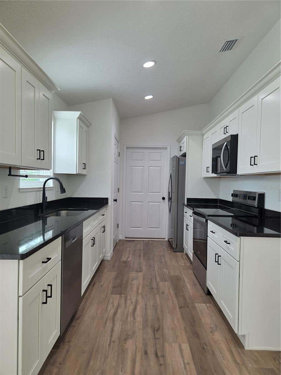 Photo of 353 Fisher Way, Ocklawaha, FL 32179 (MLS # TB8541423)