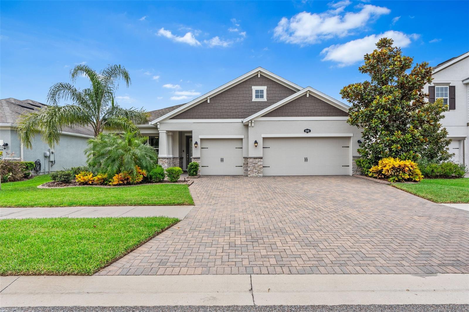 This single story exceptional POOL home with a 3-car garage is a rare find in the highly desirable "Primrose Estates," which is a GATED section of the Long Lake Ranch Community in Lutz. With an extraordinary pond and nature-view, this gorgeous 4 bedroom, 3 bathroom home is the perfect blend of elegance and comfort. Pulling up to the home you'll notice the beautiful stone elevation and luscious landscaping, adorned with curbing. The long foyer opens up to the open floor-plan common areas providing a spacious, airy feeling. At the end of the foyer is the gourmet kitchen featuring a breathtakingly oversized island, double ovens, and numerous upgrades. Across from the kitchen is the formal dining room and expansive family room, which features built-in surround-sound speakers. Stepping through the sliding glass doors, the fenced backyard features a screen-enclosed paver lanai with a luxurious SALTWATER pool, additional green-space, and a peaceful double pond and nature-view where wildlife can be seen daily. Added retractable side shades provide an additional layer of privacy when enjoying the pool. Back inside is the generous primary suite with sizable dual walk in closets and a luxurious en-suite bathroom featuring dual sinks, a makeup counter, a separated water-closet, and an oversized walk-in shower. The rest of the home features a pocket office with built-ins, a true laundry room, three secondary bedrooms, and two additional bathrooms. Not to mention, the home also has 33 PAID OFF solar panels to convey with the home, which have covered over ~80% of the owner's electricity usage costs. Additionally, the home has a water softener system to alleviate some of the hard-water experienced here in Florida. The impressive amenities in Long Lake Ranch include a resort-style pool, tennis and basketball courts, a dog park, a community room, playgrounds, and a 40-acre lake surrounded by a walking trail. The lake contains a dock where residents can fish or launch non-motorized boats from. Located near the Veterans & Suncoast Expressways, this home's location makes for an effortless commute. Highly rated schools, nearby restaurants, shopping, parks, and being within driving distance to award-winning Gulf beaches makes this the ideal location! Schedule your appointment to fall in love with this beautiful home today!