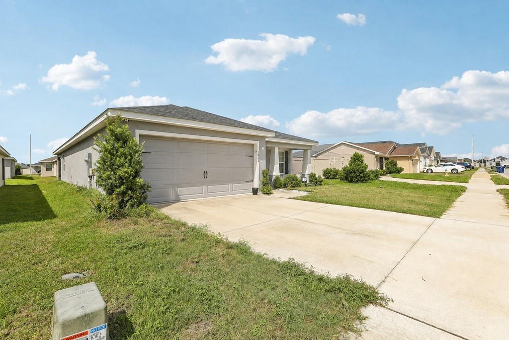 Photo of 1042 Corso Dr, Winter Haven, FL 33884 (MLS # TB8542841)