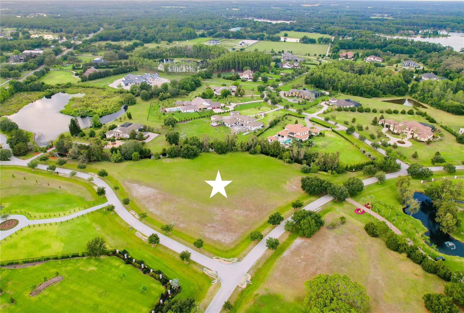 This 3+ acre homesite is one of the last few opportunities to build your custom estate in the eminent Steeplechase community of Odessa! From the moment you pass through the gated entry, you’ll be immersed in a serene country setting with 70 exclusive homesites across 280 acres, with a minimum of 2+ acre lots framed by private lakes, natural woodlands, and majestic trees. You have the freedom to select your own builder and architect. Deed restrictions require a minimum of 5,000 sq ft of living space, 3-car garage and Architectural Review Committee (ARC) approval. Conveniently located in off Boy Scout Road, the community offers quick access to Citrus Park shopping and restaurants, the Veterans Expressway, and Tampa International Airport. Head west and you’re just a short drive from Palm Harbor, Clearwater, and the Gulf Coast beaches.