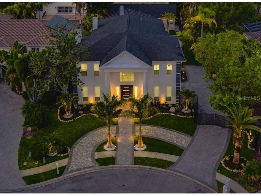 ''WELCOME TO MODERN LUXURY AT ITS FINEST''

This stunning home is a custom contemporary masterpiece that captivates you with its elegant simplicity and modern design. It is one of only 11 homes beautifully nestled in this gated, private Clearwater, FL enclave. The home boasts 6334 sq ft of lavish living space with a detached in-law guest house. Recently fully updated with imported designer finishes: Over $600k in upgrades completed in 2022; high end gourmet chef's kitchen - an entertainer's dream within the comfort of a warm home. Every bathroom has been fully updated to match the impeccable design. From the new lush landscaping, lighting. Koi pond with large waterfall/water features, creating a tranquil sanctuary. To the amazing large free form, heated, salt water pool, large sun deck, infinity edge spa/hot tub - and outdoor shower! Multiple lounge/dining areas, fire pit to set the perfect evening... Extra large driveway capable of fitting 10 cars comfortably and oversized 3 car garage. This house is turn key and amazing!

Enter the redesigned interior, step into the BRAND NEW gourmet chefs kitchen featuring all new appliances, seating for +15. To the fully updated, high end designed 7 bathrooms (5 full, 2 half), top of the line fixtures/designs. Ensuite bedrooms and so much more.

The home is located close to everything... Grocery stores, restaurants, movie theaters, Countryside Mall (just 8 minutes away), less than a mile away from Countryside Golf Club, 7 miles away from Dunedin Beach, Clearwater Beach also minutes away, Tampa International Airport is a short 12 miles away. And just outside of the gate is Forrest Run Park, which has tennis and basketball courts.