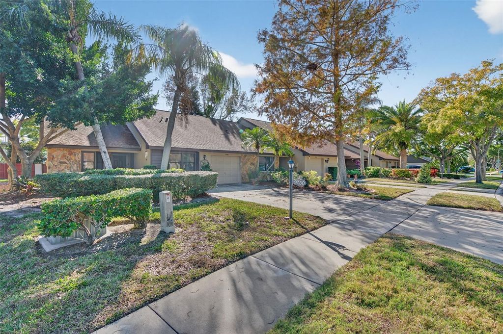 Photo of 9750 Lake Seminole Drive E, Largo, FL 33773 (MLS # TB8462266)