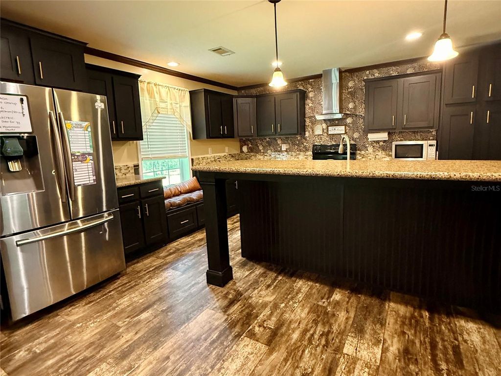 Photo of 9711 SE Highway 464c, Ocklawaha, FL 32179 (MLS # OM723134)