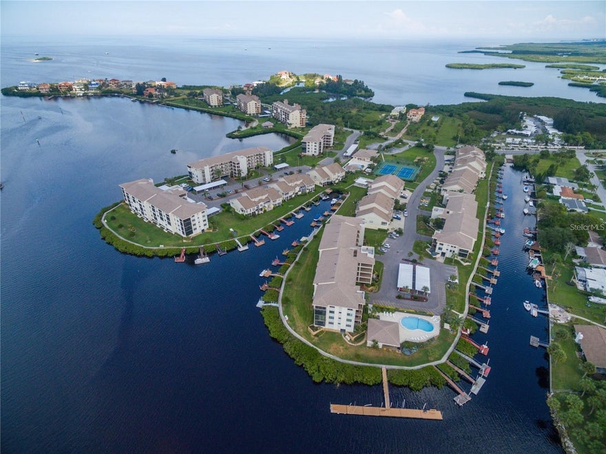 Beautiful, FURNISHED or  condo with direct view of the Gulf of America available for lease. AVAILABLE starting DECEMBER 6 2026 . # months minimum or longer. Enjoy the waterfront view from the kitchen, dining room, living room, master suite and screened patio. Kitchen offers newer kitchen cabinets with granite countertops, a flat top range/oven, side by side refrigerator, dishwasher and full size washer and dryer. Living room and dining room have beautiful cherry color wood flooring. Both bedrooms have newer carpet. The master bedroom has large private bath with walk in shower, built in vanity and large walk in closet with custom cabinetry. Guest bath is remodeled with gorgeous vanity, granite counter tops and newer tile. Screened patio offers and unobstructed view of the Gulf of America. Assigned under building parking and storage locker. Community offers: 24 hour manned security gate, pool, private beach area, boat ramp, tennis courts with pickleball, waterfront boardwalk, putting green and Clubhouse with fitness, game tables and library. This complex is close to waterfront dining, medical, shopping, water sports, historic downtown New Port Richey and more!! It is approx 45 min to the Tampa Airport, Tampa Cruise port, and Tampa theme parks, approx 60 min to famous Clearwater Beach, 20 min from Tarpon Springs Sponge Docks, approx 2 hours to Orlando Theme Parks. FIRST, LAST AND SECURITY required to move in. NON SMOKING UNIT.
