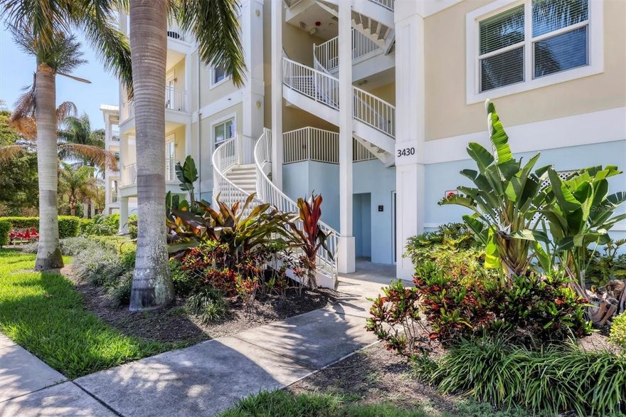 SERIOUS SELLERS! This home stands out! Stunning three bedroom two and one half bath first floor condo has Spectacular Sunset Views Overlooking the lake with two balconies and complete with HIGH END DECORATOR FURNISHINGS. Barely lived in and lovingly maintained. Key Largo Floor Plan that lives large. Just replaced HVAC with a Lennox high efficiency system. Palma Sola Bay Club is Resort Style Living! Offering a community pool, clubhouse with kitchen, meeting room, pool table & fitness center. Grill poolside or relax around the firepit, practice on the putting green or try your hand at Bocce Ball. Bring your pups to the community dog park Launch your kayak into Palma Sola Bay or fish from the private community dock!
Two parking spaces below the building with secure storage area with racks for kayaks, paddleboards or bicycles. The location is remarkable minutes to the gulf beaches of Anna Maria Island. Convenient to shopping, restaurants, IMG Academy, and medical facilities. Start living your carefree Florida resort lifestyle now! Don’t miss out