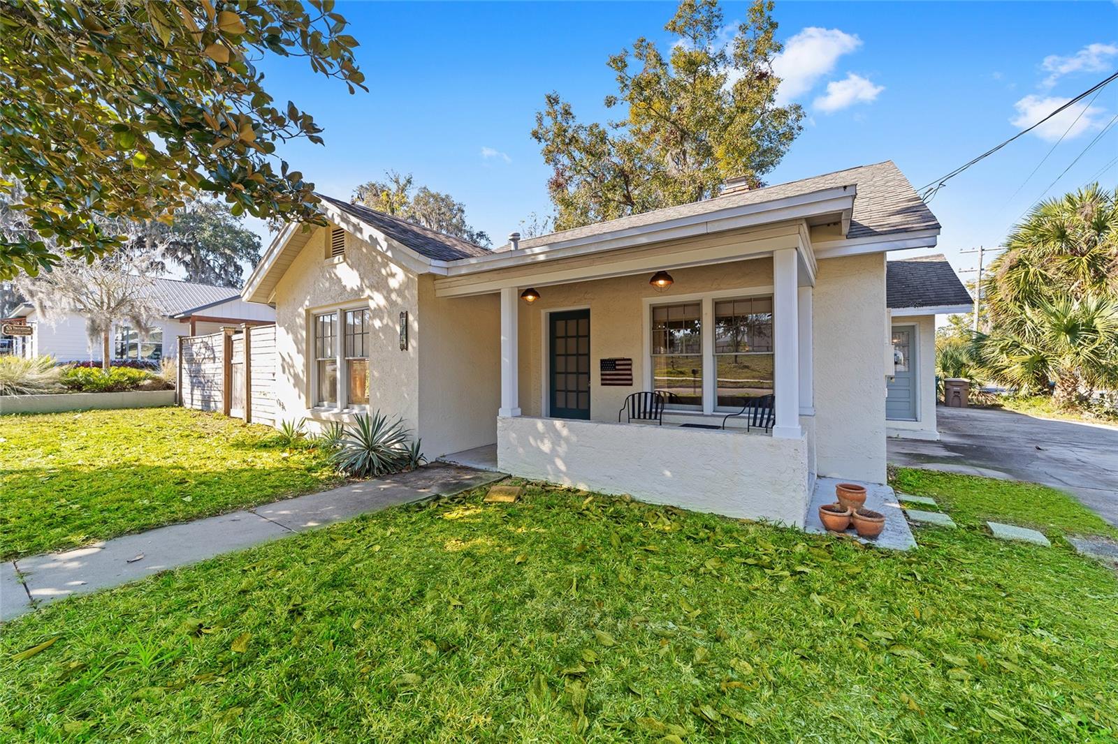 Discover this beautifully remodeled home near the edge of Ocala's historic district! Placed on a spacious corner lot, the home features lots of curb appeal with a mature magnolia tree in the front yard and a cozy covered front patio and entryway with tongue and groove wood ceilings. Zoned RO (Residential-Office), the property also offers unique flexibility for potential future professional use, making it a smart option for those seeking a live-work opportunity close to the heart of the city. Recently updated, the home features a total of 3-bedrooms and 2-baths with roughly 1,500 sq ft of space. Rich wood flooring runs throughout the living and dining areas, while tile and carpet provide comfort and functionality in the other spaces. A gas fireplace adds warmth and character to the living area, a perfect option for cozy evenings. The kitchen is well-suited for those who enjoy spending time cooking, complete with stainless steel appliances, ample cabinet storage, and tongue-and-groove wood ceilings that enhance the room’s charm. The spacious primary suite is a true retreat that includes French doors, a generous layout, walk-in closet, and a recently updated en-suite bathroom with pedestal sink and walk-in shower. Modern paint choices made throughout the home give a fresh, stylish feel while the many windows allow in abundant natural light. A Florida room– also featuring tongue-and-groove ceilings– extends the living space, leading to a large backyard that features wooden privacy fencing that is perfect for entertaining, pets, or simply quiet relaxation. NEW HVAC, and NEW ROOF. Situated within historic downtown Ocala, this move-in ready home is located just minutes from a variety of shopping, dining, entertainment, and medical options and only 10-15 minutes from the World Equestrian Center. Don’t miss out on this incredible opportunity– schedule your showing today! Property is available for rent.