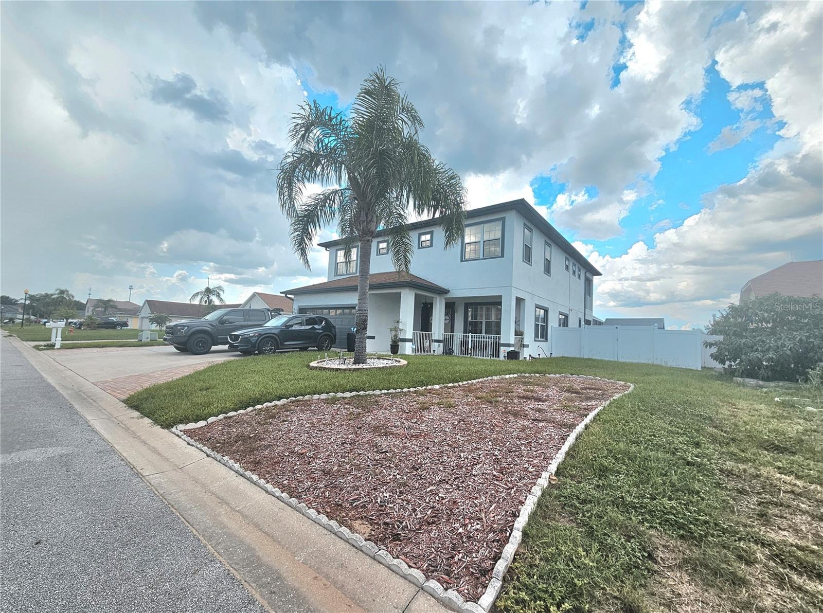 BEAUTIFUL HOME WITH DISNEY FIREWORKS VIEWS AND A POOL AND SALTWATER JACUZZI. 5 bedrooms, 4 bathrooms, a spacious 3-car driveway. Out back is an oversized poolside deck and large covered patio, with a spiral staircase leading up to the second-floor balcony/loggia, overlooking the pool, plus fabulous views of Disney's Magic Kingdom and Epcot fireworks. The master bedroom is HUGE and spans the entire back of the house! It features double closets, an office/nursery, a dressing area, a double shower, and dual air conditioning. Plus, the low HOA dues make this an unbeatable property! Great for primary residences, second homes, investors, and the short-term rental market. Conveniently located between Orlando and Tampa, near our numerous theme parks and attractions, restaurants, shopping, major highways, golf courses, and much more.