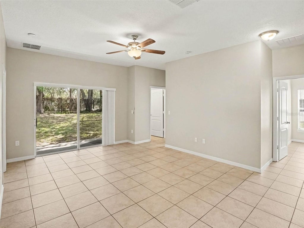 Photo of 5007 Shale Ridge Trail, Orlando, FL 32818 (MLS # O6446102)
