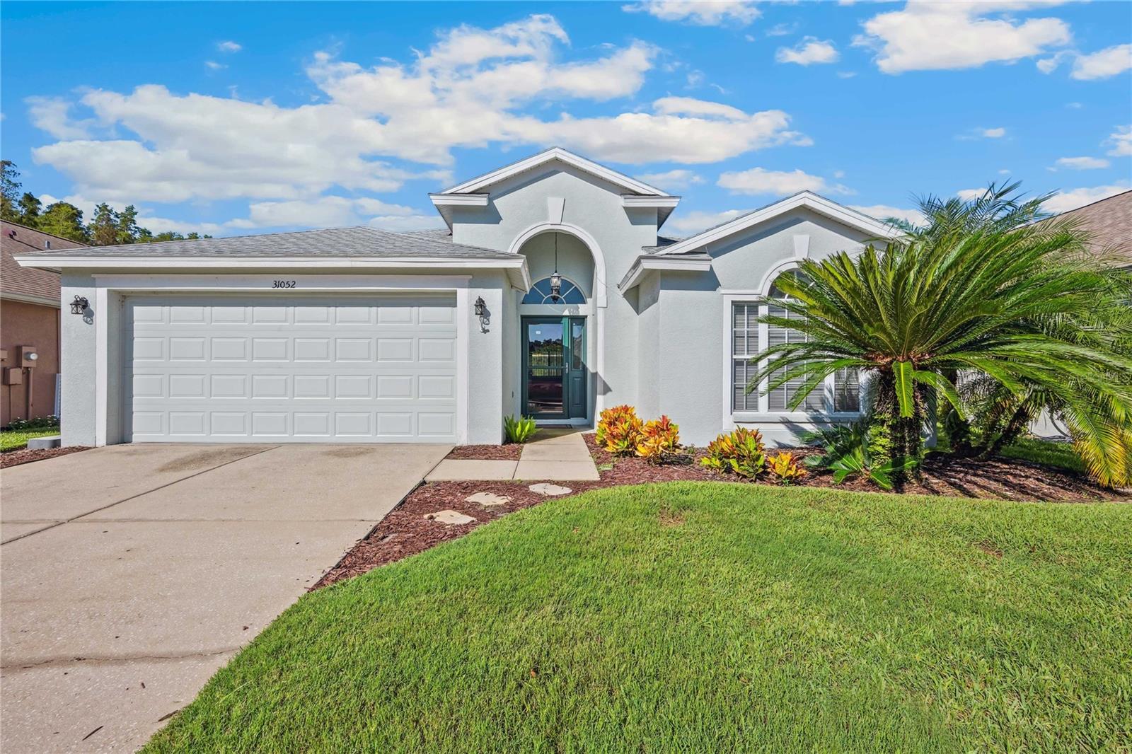 SELLER OFFERING $5000 towards closing costs with an accepted offer. This beautiful POND view, POOL home is waiting for you! Located within the desirable Meadow Pointe GATED community of Wrencrest with LOW HOA/CDD fees, this home offers an open concept floor plan with kitchen perfect for the chef in the house or for entertaining family and friends. Equipped with newer STAINLESS STEEL appliances including NATURAL GAS range, cabinetry offering ABUNDANT STORAGE, an ISLAND with ample space and large sink. EAT IN dining area nestled in front of the large window provides a delightful mealtime view at any time of the day. The NATURAL LIGHTING keeps the entire home pleasantly bright all day into the evening. Enjoy UPGRADED ceramic plank tile flooring throughout (that's right NO CARPETS). The primary bedroom offers TWO WALK IN CLOSETS with en suite featuring DOUBLE SINK vanity, GARDEN TUB and WALK IN SHOWER. 3 other generously sized bedrooms and second full bathroom complete this ideal lay out. Outside enjoy the pool and large pond view from the covered lanai making this the perfect spot to enjoy your morning coffee or the evening sunset skies. UPDATES include Interior/Exterior paint (2024), WATER HEATER (2024), GARBAGE DISPOSAL (2022), KITCHEN FAUCET (2024), POOL PUMP (2022), STORM DOOR (2020), ROOF with wind mitigation feature that also comes with a transferable warranty (2020), and upgraded ceramic tile flooring. Meadow Pointe is an excellent location adjacent to New Tampa offering easy access to everything Wesley Chapel/New Tampa have to offer including major highways, shopping, and dining, as well as TOP RATED schools. Community features a Clubhouse with pool, splash pad, tennis courts, basketball courts, volleyball courts, playground and fitness center. Schedule a showing today!