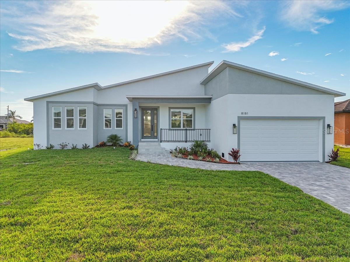 NEW PROPERTY READY TO MOVE. Welcome to your slice of FLORIDA PARADISE! located in the highly 93 zone in SOUTH GULF COVE. the community have club house, boat ramp Park Sidewalk. This stunning 4-bedroom, 4 bathroom plus FLEX ROOM/OFFICE. Home is situated on a spacious lot in a peaceful neighborhood, the house is across the street from the canal. Front the park ramp in the community you can enjoy navigating for the canals and end in Myakka River, just minutes from Charlotte Harbor, Englewood and all Gulf Coast Beaches , Boca Grande Island , as well as the marinas. Step inside the house and fall in love with the Haigh ceilings that create an airy, open feel throughout the sunlit living area in this open-concept home. The island kitchen stainless steel appliances, and a roomy pantry. The primary suite includes a generous walk-in closet and a large shower. The house is designed to meet the new flood elevation code and is equipped with impact-resistant glass windows and doors to provide peace of mind. The flooring is 48"x24" porcelain tile throughout the house. Enjoy outdoor living year-round on your open lanai. With NO MANDATORY HOA, this property is perfect for full-time residents alike, snowbirds, or investors, Bring your boat or RV and you can also enjoy your golf car around—you’re close to boat ramps, golf courses, shopping, dining, and I-75 for an easy drive to Sarasota, or Fort Myers and Naple Your Gulf Coast dream home awaits!