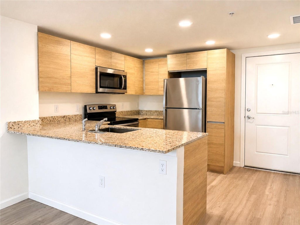 Photo of 1230 Southstation Place #201, Orlando, FL 32809 (MLS # O6435642)