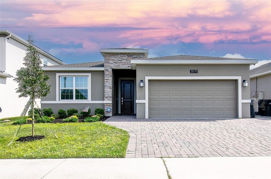 Welcome to the next top of the line energy efficient NextGen home! Located in the Beautiful Providence Golf Community. This 2.5 year home has  leased solar and water filtration systems and embodies the making of new family memories with a large open concept kitchen/living room combination. The kitchen boasts 42 inch white cabinets, quartz countertops, stainless steel appliances and an island that seats four comfortably. The laundry room sits between the kitchen and 2 car garage. All 3 bathrooms have quartz countertops that match your kitchen. A large primary bedroom with two closets (one is a walk-in) and a beautiful bathroom with a walk-in shower. The In-law suite has it's own entrance, living room, bedroom, bath, kitchenette and laundry unit.  The driveway has been extended to fit 3 vehicles(depending on the size).  Sit on the screened patio to watch beautiful sunrises and wild life.  Providence is resort style living at it's best with a fitness center, 
tennis/pickleball courts,  2 pools, dog parks, restaurant and a pay as you play 18  hole golf course. LOW HOA fees and NO CDD. Rooms sizes are from the original builder, buyer to verify.  Video Surveillance on premises.