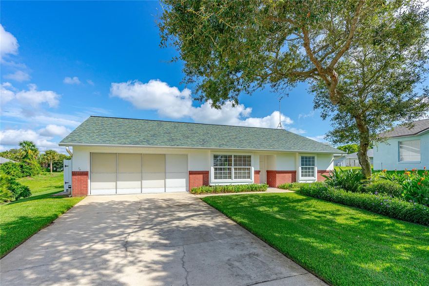 This Beach-side, open and bright, immaculately kept home has been maintained in pristine condition. A half-block away is an easement shortcut that allows you to walk to the beach in 0.2 miles. Walk up to the front door where a Ring video-doorbell provides peace of mind. The entry foyer leads to a spacious, open concept to the living room and dining room which features 12-foot vaulted ceiling. A large skylight and two patio sliders flood the house with natural light. The living room also features a beautiful solid brick, wood-burning fireplace with a rustic beam mantel to keep you warm on cool nights. The dining room has a beautiful chandelier and a pass-through opening to the kitchen making entertaining a breeze..

In the gorgeous, classic all-white kitchen, you will find cabinets that provide storage to the ceiling, with sleek, modern white appliances, a deep under-mount stainless sink, Delta faucet with pull-out sprayer and a heavy-duty garbage disposal. All appliances are newer including refrigerator/freezer with ice maker, self-cleaning oven with smooth-surface easy-to-clean top, and 5 level-wash system dishwasher. A large window with built-in window-seat, ceiling fan, a mosaic-glass tile backsplash and high-end quartz countertops complete this lovely kitchen. The spacious main bedroom boasts a walk-in closet, a large window, skylight and ceiling fan. The ensuite bathroom was completely remodeled in 2019 and has a walk-in tiled shower with Moen faucets, and a large vanity with a granite countertop. The roomy second bedroom has a walk-in closet, window-seat and ceiling fan. A second bathroom with full-size tub/shower combo opens to both the bedroom and the main hallway. All the windows and patio doors are all impact-resistant and hurricane-rated made to withstand extreme weather. Hot water heater installed 2021, Washer 2021, Dryer 2015. A high-efficiency Carrier Infinity Series Air Conditioner/ Heat Pump was installed in 2018. The Roof was replaced in 2017. The two-car garage has a pull-down attic with plywood flooring. The heavy-duty garage door was replaced 8 years ago and is hurricane rated; it includes full width sliding screens. The garage door opener was replaced June 2023. A side-door from the house leads you to a private outdoor shower. Outdoors you will find a professionally landscaped yard with mature gardens, shrubs and trees. An 8x10 foot shed holds your beach and lawn equipment and has a large, custom flower box. An oversized, back patio spans the width of the house and provides lots of space for ideal outdoor living. The outdoor firepit completes your private backyard retreat. One of the best locations in the area, this secluded, mature lot, is next to a "green belt" providing a huge privacy buffer. Privately located at the end of a cul-de-sac with zero drive-by traffic. It is finally your chance to call this your home. It is being offered for the first time since 1992 and is priced to sell! ;Water: City