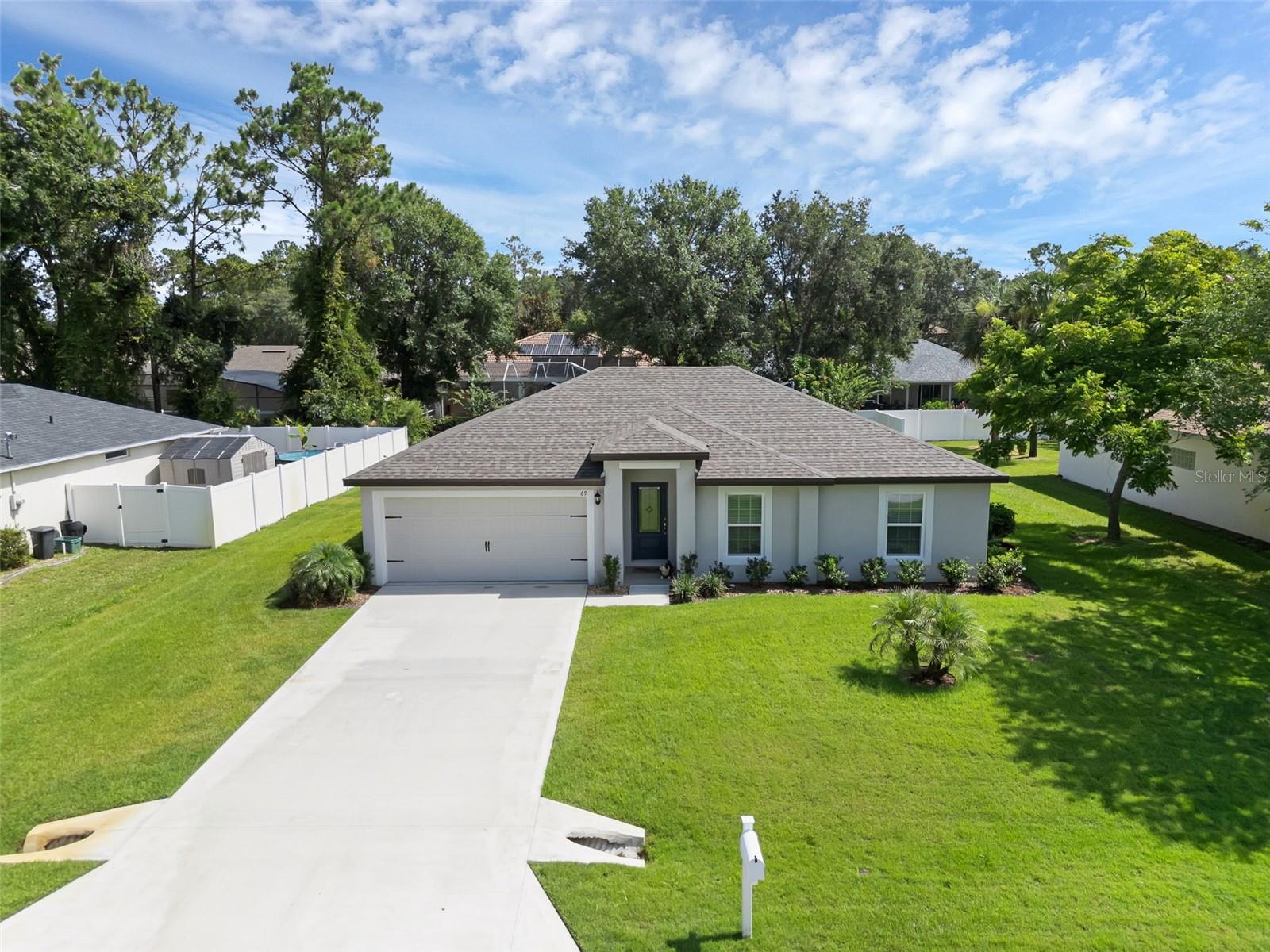 Welcome to this charming and move-in ready 3-bedroom, 2-bathroom home built in 2023, nestled in the heart of Palm Coast.
Step inside to discover an open and airy floor plan with light-filled living and dining areas, complemented by durable vinyl flooring throughout the main spaces. The modern kitchen is thoughtfully designed with granite countertops, stainless steel appliances, and a seamless flow into the living area—perfect for both entertaining and everyday living.
Enjoy the privacy of a split-bedroom layout featuring a spacious primary suite with a walk-in closet and an en-suite bathroom complete with a stand-alone shower. On the opposite side of the home, you’ll find two comfortable guest bedrooms and a full bathroom with a tub/shower combo.
Glass sliders from the living area lead to a generously sized backyard—ideal for outdoor relaxation, play, or future personalization. Additional highlights include a convenient laundry closet, a 2-car garage, and an extended driveway for extra parking.
Located between Daytona Beach and St. Augustine, Palm Coast offers high-quality living at an exceptional value. This home is close to top-rated schools, shopping centers, churches, and major roadways including I-95 and US-1. The Palm Coast Town Center is just minutes away, offering a variety of dining, retail, and entertainment options, with beautiful beaches only a short drive away.
Don’t miss the opportunity to make this beautifully built 2023 home your own!