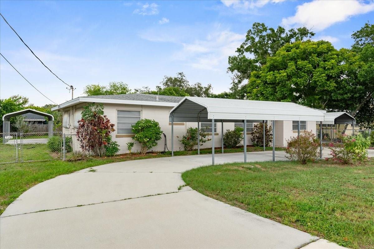 Welcome to 121 Coleman Road in Winter Haven—an updated 3 bedroom, 2 bath home that offers space, comfort, and flexibility at a great price. From the start, the circular driveway and three covered metal carports give you plenty of room for cars, boats, or weekend toys. Inside, you’ll find a light and open layout with two living rooms, a den, and a separate dining area—giving you plenty of room to relax, entertain, or even work from home. The home has been well cared for and features many recent updates including 2023 interior paint, vinyl plank flooring, updated lighting and ceiling fans, new doors, a 2023 A/C system with new ductwork, a 2020 water heater, and a 2016 architectural shingle roof. The kitchen has solid surface counters—both Corian and butcher block—stainless steel appliances, subway tile backsplash, and lots of cabinet space. The primary bedroom includes an updated private bathroom with a walk-in tiled shower, new fixtures, and a modern vanity. The two guest bedrooms are roomy and share a second updated bathroom with another walk-in tiled shower. Need more space? One of the living rooms can be turned into a 4th bedroom, game room, or home theater. Outside, a screened-in patio overlooks a large fenced backyard with a storage shed/workshop—perfect for hobbies, tools, or just enjoying the outdoors. Living in Winter Haven means you’re close to everything—lakes, parks, local shops, and a charming downtown with restaurants, festivals, and events. You’re also just 6 minutes from the Polk Parkway, making it easy to reach Lakeland, Tampa, or Orlando. With no HOA and a long list of upgrades, this home is a great find in a growing and well-loved Central Florida community.