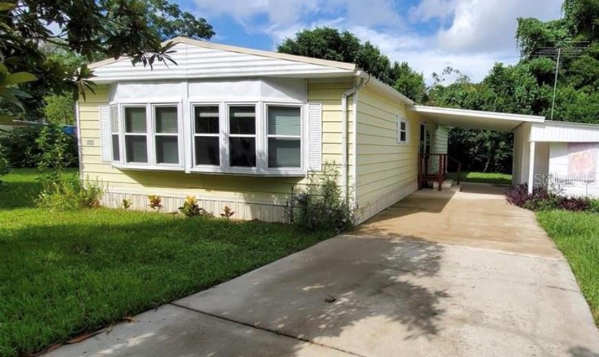 This centrally located, and well maintained home sits just outside of Belleview city limits. Features 2 bedrooms, and 2 bathrooms. Master bedroom features a large walk in closet and ensuite mater bathroom. Nice fenced in lot on a dead end street is an added bonus, with an nice carport and laundry/workshop area. Close proximity to shopping, medical, entertainment and restaurants. Double pane windows added in 2008. Lifetime metal roof installed in 2013. HVAC replaced in 2014. New hot water heater installed in 2021, as well as new ceiling fans. New septic tank and drain field just installed in 2022, as well as a new metal roof added to the block workshop/shed.