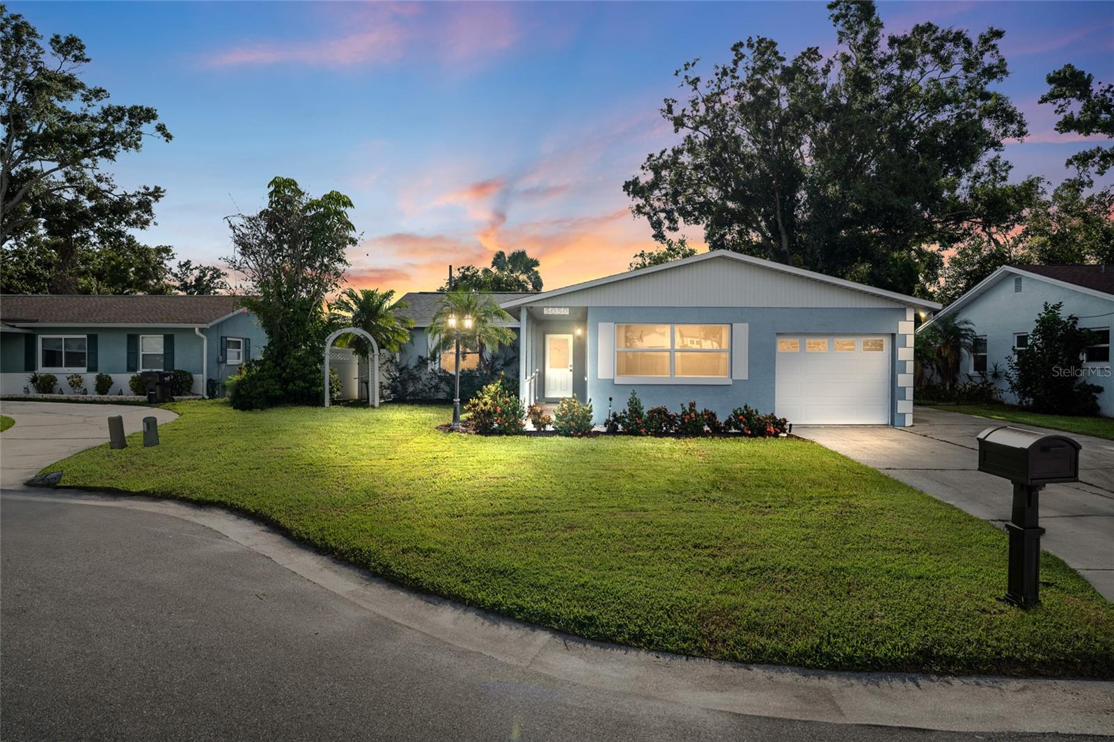 This beautifully updated 3-bedroom, 2-bathroom pool home is tucked away on a quiet cul-de-sac in a non-flood zone location. Bright and airy, the main living space features large windows that let in lots of natural light, along with porcelain tile flooring throughout. Step into the spacious dining area, which leads to the kitchen with granite countertops, stainless steel appliances, a breakfast bar, and a window over the sink over looking the pool. Outside, the screened-in pool area is surrounded by lush Areca palms, creating your own private, tropical oasis, ideal for both relaxing and entertaining. Two small side yards offer additional space, one with a shed for storage. Off the kitchen, you’ll find a private laundry room with a full size washer and dryer. The layout is divided: On the left, you’ll find a bathroom, another bedroom, and the primary bedroom with a walk-in closet. On the right side of the home, there’s a bedroom, bathroom and a one-car garage. Major updates include a new roof (2023), water heater (2020), brand new ductwork, and a Wi-Fi–controlled well irrigation system. Both the AC and pool pump are in excellent working condition. Located just under 15 minutes from vibrant downtown St. Pete and 20 minutes to Madeira Beach, this property sits in unincorporated Pinellas County, meaning short-term rentals are allowed. Whether you're looking for a primary residence, vacation home, or investment property, this one checks all the boxes. Furniture, décor, and patio furniture are negotiable.
Love where you live! Schedule your private tour today!