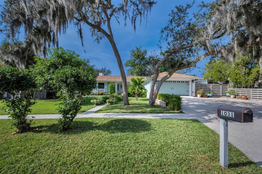 Discover this truly one-of-a-kind Tarpon Springs retreat—an artist’s delight—located in the highly desirable Sunset Hills neighborhood. Set on a private, oversized, fully fenced lot on a natural ridge 25 feet above sea level, this home is just blocks from the Anclote River and less than two miles from the Gulf beaches. It is outside a flood zone, has never flooded, and comes with the benefit of NO HOA restrictions. This secluded pool home includes a new horizontal shadow box fence and thoughtful custom artistic updates by only the second owners. Features include interior frosted glass panel doors and 5 1/4-inch trim (2024), custom lighting (2024), new ceramic tile in primary living areas (2023), and a beautiful wood-burning fireplace. Additional updates include a freshly painted interior (2024), LG stainless steel kitchen appliances (2024), and marble-surface bathroom vanities (2024). The eat-in kitchen offers solid surface countertops and a hand-done sea glass countertop. Practical upgrades include a grilling patio off the kitchen, new Trane 3.5-ton HVAC (2025), new electric panel (2023), new hot water heater (2025), automatic pool filler (2025), high-impact windows with hurricane shutters for all other openings, and a new 50-year architectural shingle roof (2023). The great room offers double sliding glass doors that open directly to the pool area, creating a bright indoor-outdoor living experience. The primary bedroom is spacious and features a walk-in closet. The second bedroom includes large double closets, providing excellent storage, and the third bedroom is currently used as an office, offering an ideal workspace or versatile flex room. All bedrooms are generously sized and well-appointed. Outdoor living shines with a screened lanai overlooking the sparkling plunge pool, lush tropical landscaping, pavered areas, a separate garden area, a new Tuff Shed with windows, and a large two-car garage with an additional parking area ideal for your camper or water toys. Fred Howard Park—just 1.5 miles away—is beloved for its sandy beach, scenic causeway, and calm waters perfect for paddleboarding and sunset walks, while nearby Sunset Park offers a quiet shoreline spot ideal for fishing, relaxing, and taking in serene Gulf views. The home is also only 16 miles to world-famous Clearwater Beach, 30 miles to St. Petersburg, and 25 miles to Tampa International Airport. The historic Sponge Docks are just 2.5 miles and provide a vibrant historic district known for its waterfront dining, boutique shops, and charming maritime atmosphere. Downtown Tarpon Springs is just 2 miles away and hosts a vibrant historic district known for its popular First Friday street festivals featuring live entertainment, shopping, and outdoor dining.  Tarpon Springs is a vibrant community with year-round public events including holiday boat parade, Spring Bayou Seafood Festival, a regional arts fair, summer concerts and movie nights at the beach, and a fall triathlon/duathlon.  A Choice Home Warranty is included through January 2027, completing this exceptional Tarpon Springs sanctuary.